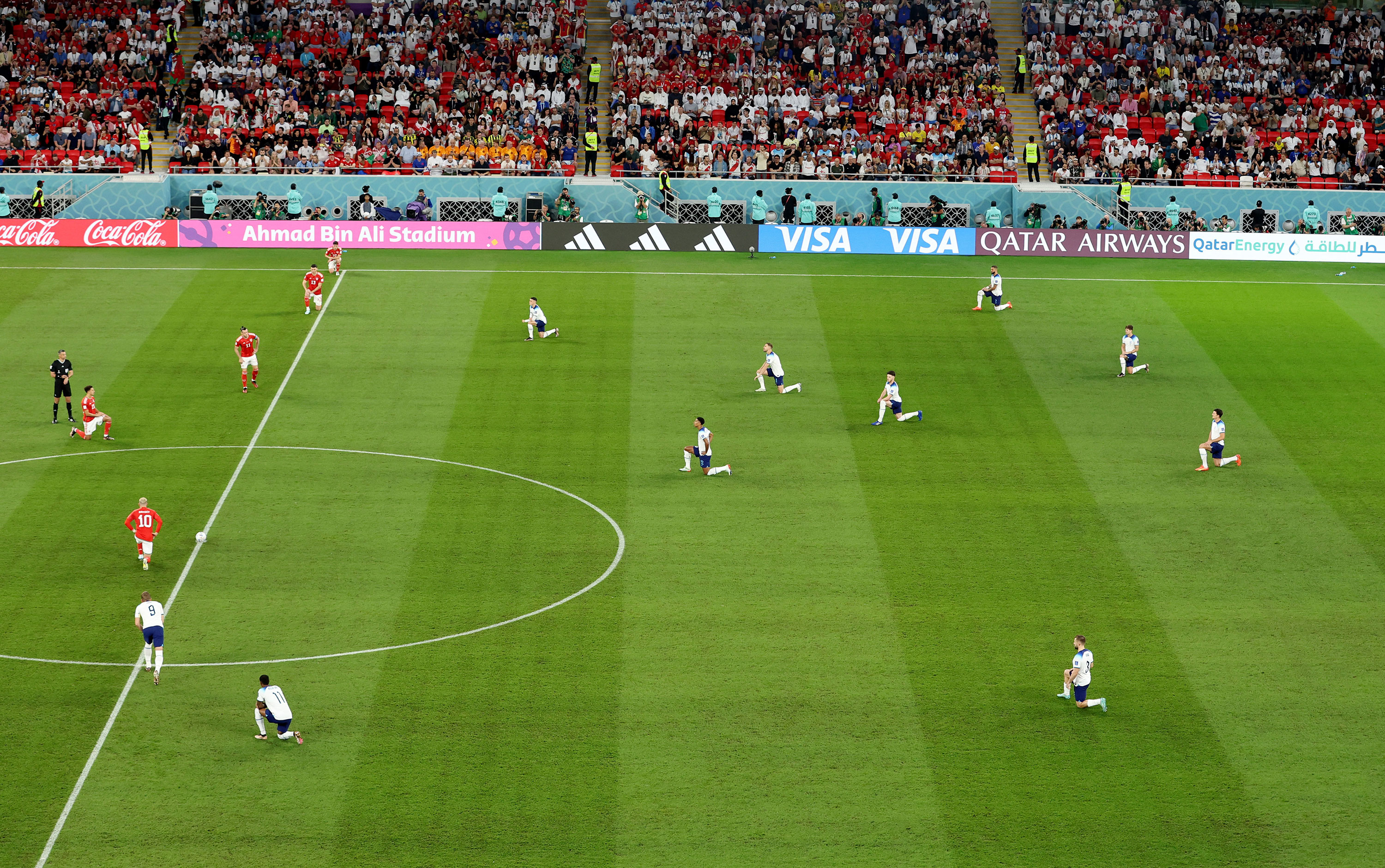 England players take a knee before the match against Wales on Tuesday.