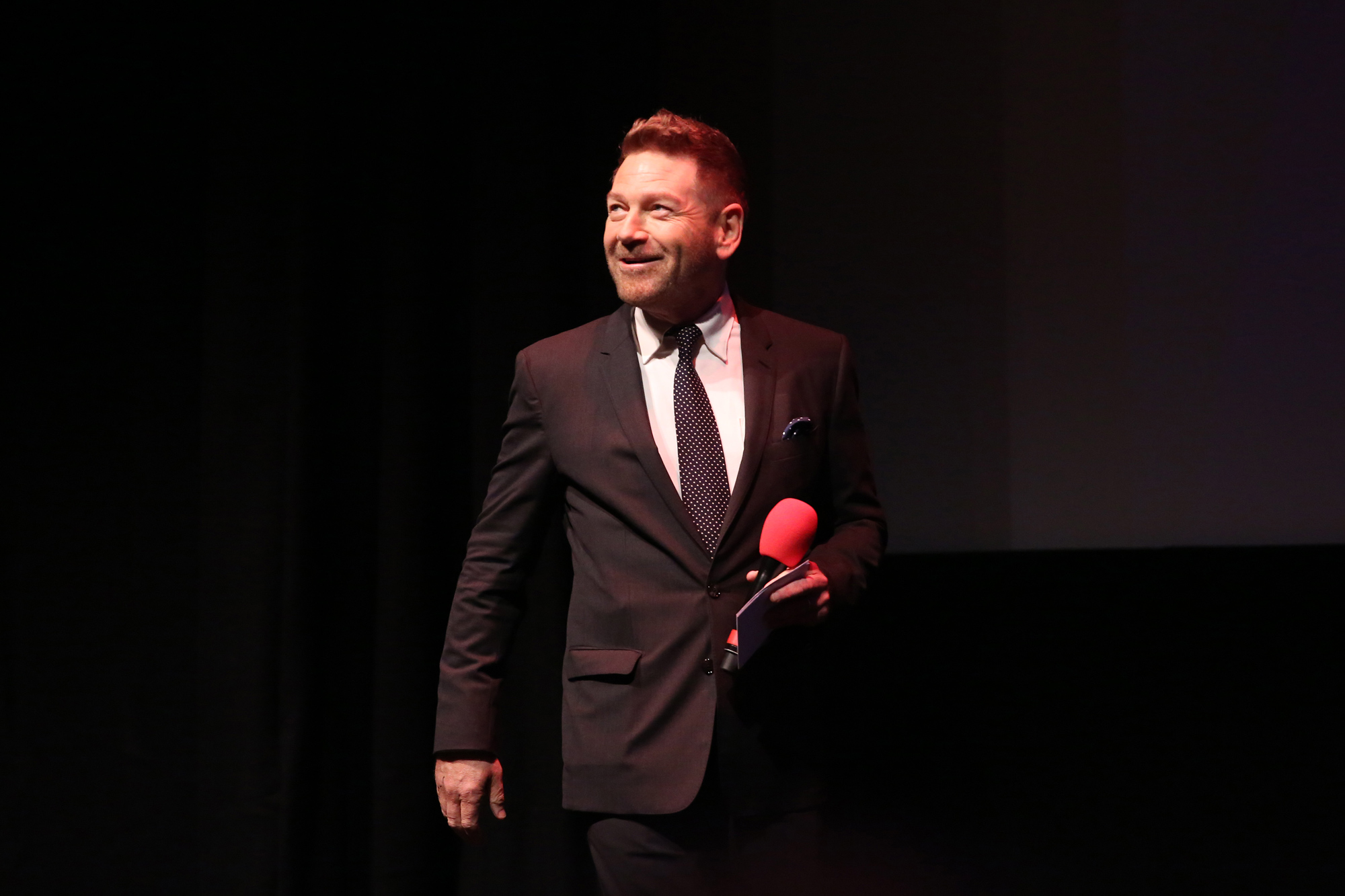 Kenneth Branagh speaks on stage at the "Belfast" European Premiere during the 65th BFI London Film Festival at The Royal Festival Hall on October 12, 2021, in London.