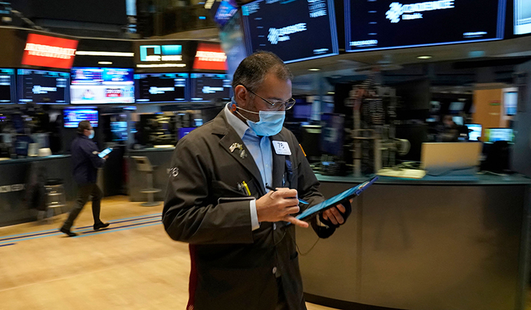 Traders work on the floor of the New York Stock Exchange at the opening bell on January 25.