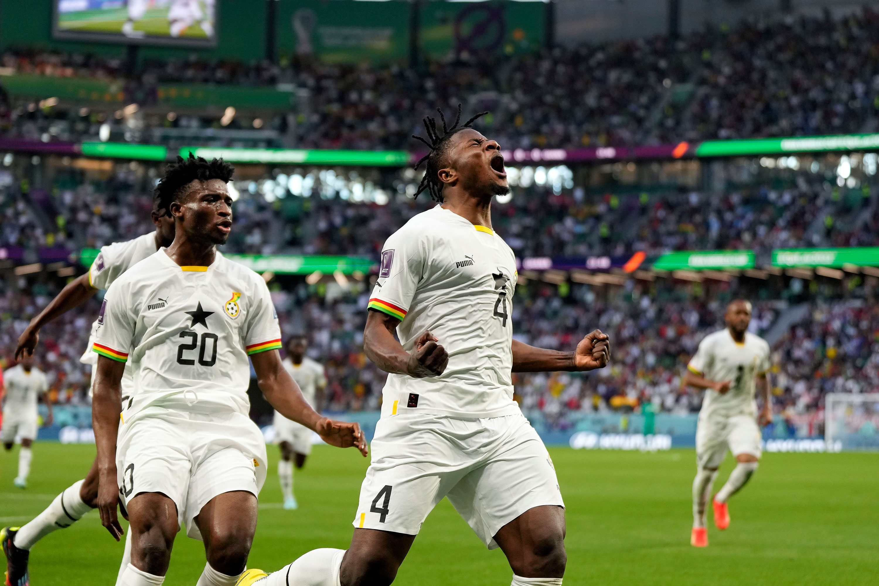 Ghana's Mohammed Salisu, middle, celebrates after scoring the opening goal against South Korea on Monday.