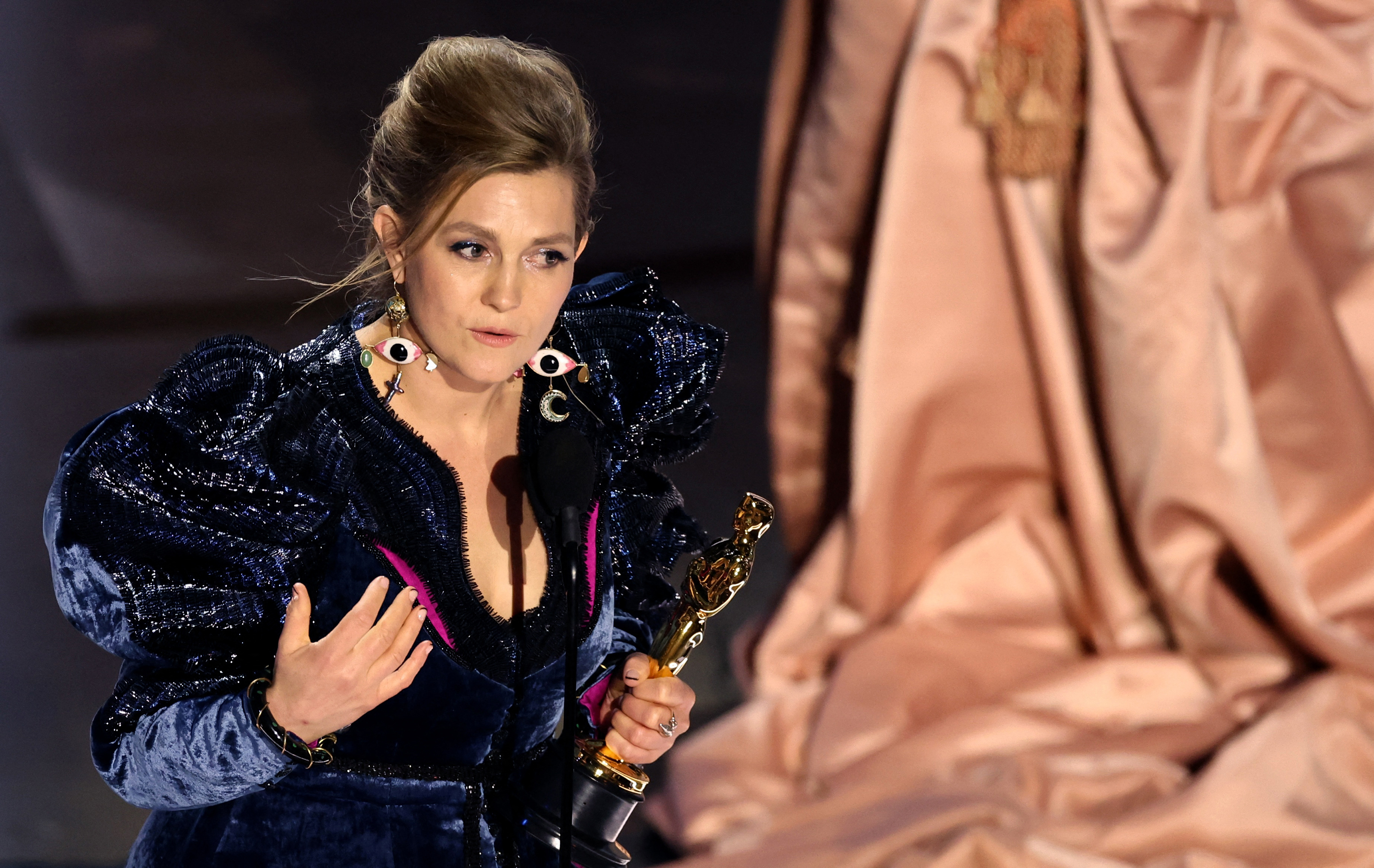 Holly Waddington accepts the Oscar for best costume design for "Poor Things.” 