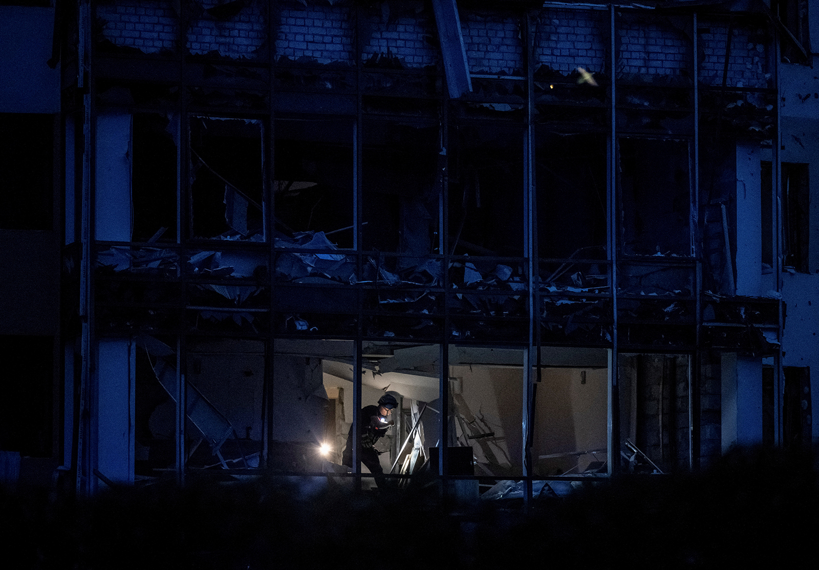 An expert works at the site of a Russian missile strike in Zaporizhzhia, Ukraine on August 10.