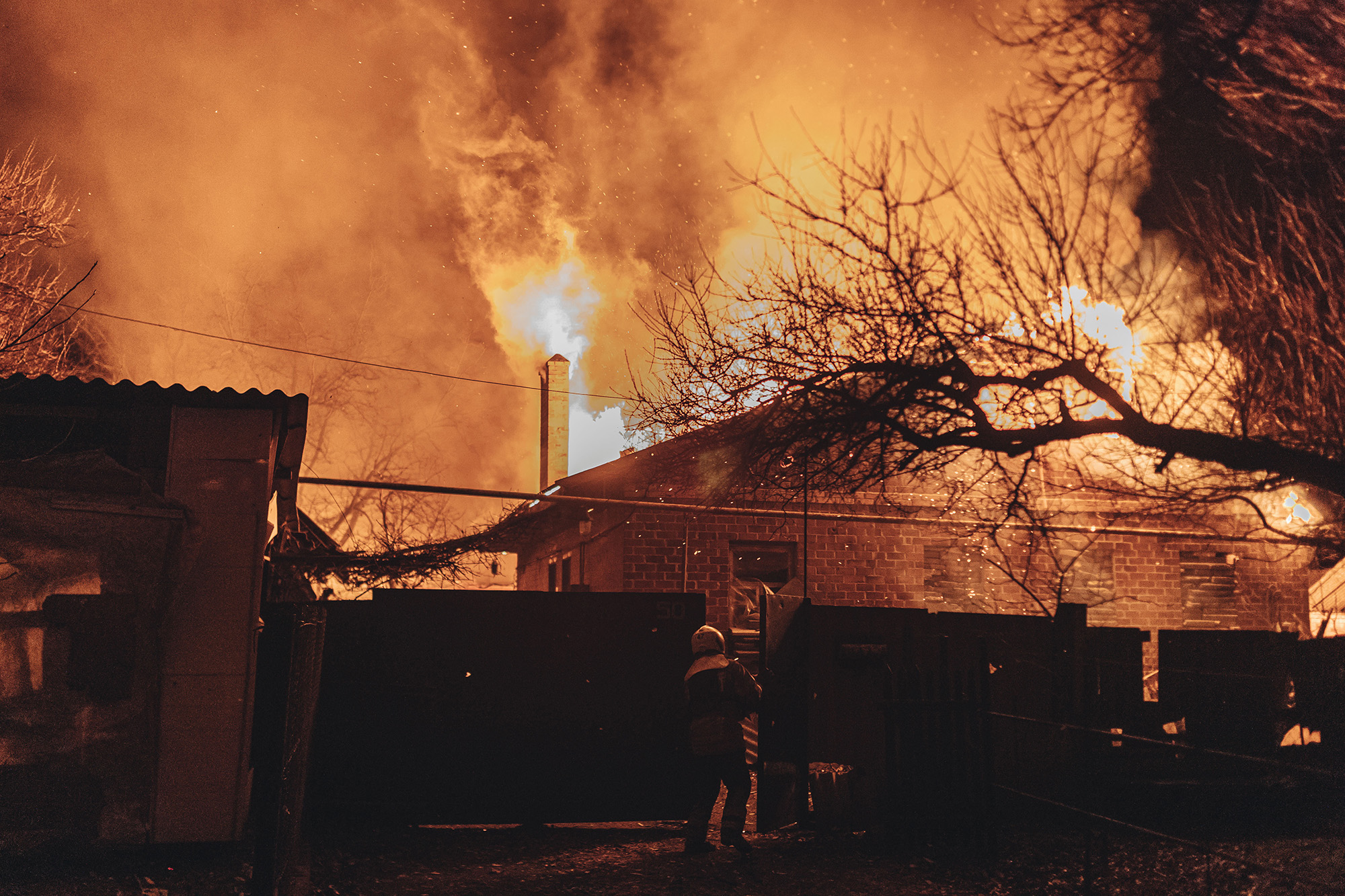Emergency service workers extinguish a fire after shelling on the Bakhmut frontline in Ivanivske, Ukraine on January 2.