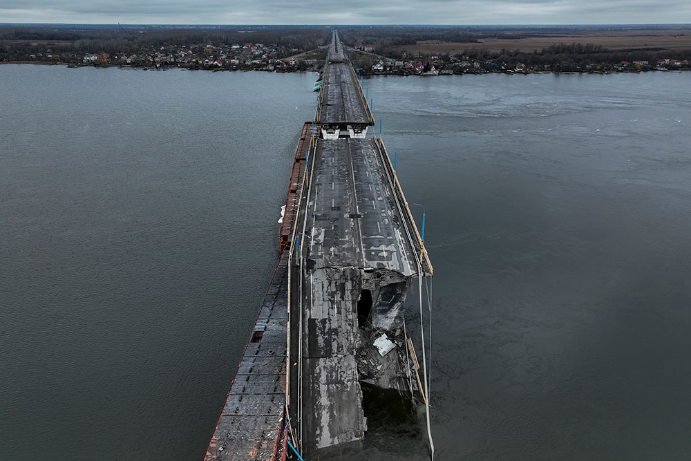 Damage seen on the Antonivsky Bridge in Kherson, Ukraine, Sunday, November 2.  The bridge, the main crossing point over the Dnipro River in Kherson, was destroyed by Russian troops in early November, after Kremlin forces withdrew from the southern city. 