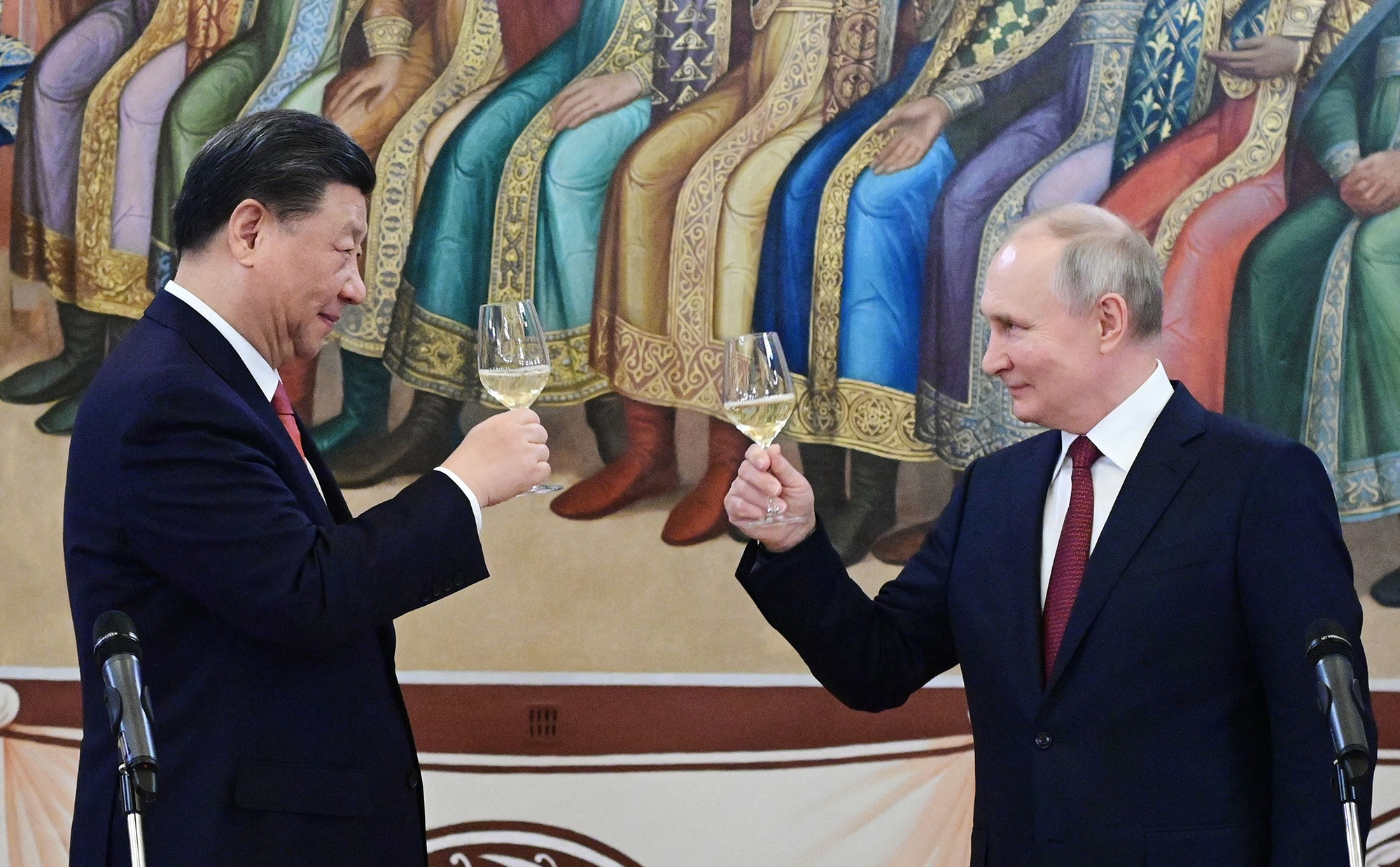Russian President Vladimir Putin, right, and China's President Xi Jinping make a toast during a reception following their talks at the Kremlin in Moscow, Russia, on March 21.