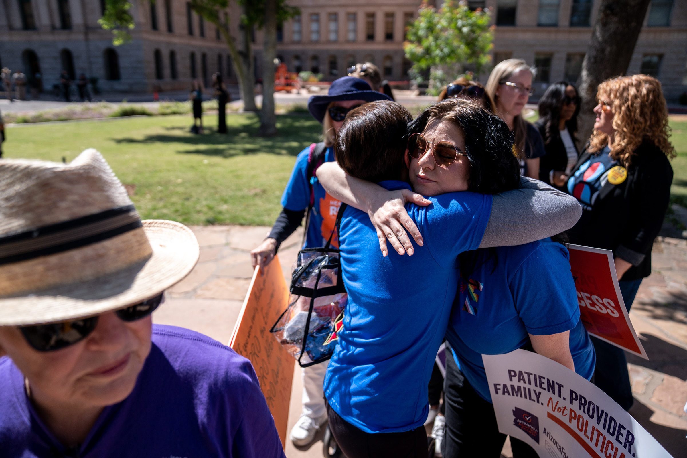 Abortion rights activists Marion Weich hugs Carolyn LaMantia during a news conference addressing the Arizona Supreme Court's ruling to uphold a 160-year-old near-total abortion ban at the Arizona state Capitol in Phoenix on April 9.