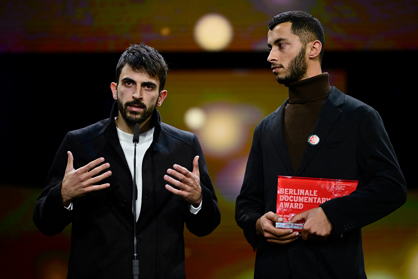 Israeli director Yuval Abraham, left, and Palestinian director Basel Adra speak on stage during the awards ceremony of the 74th Berlinale International Film Festival, in Berlin on February 24.