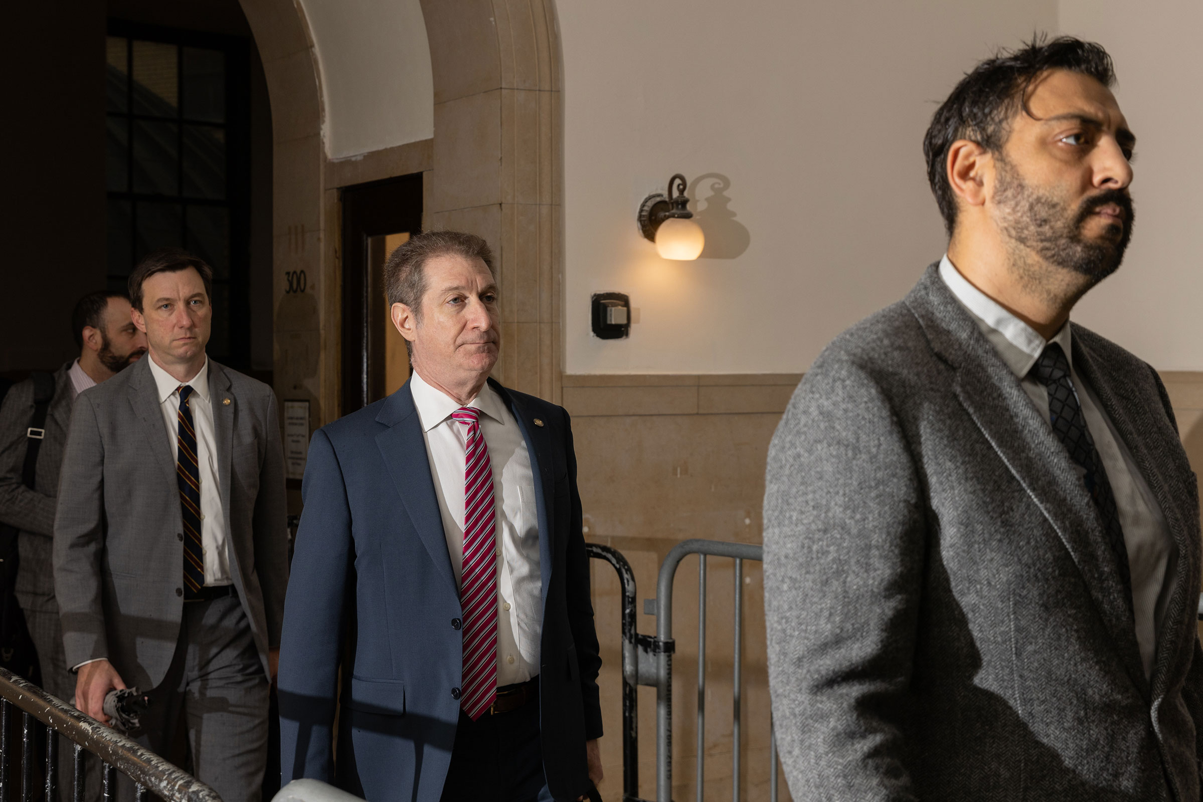 In this October 2023 photo, Andrew Amer, prosecutor for the New York State Attorney General, center, arrives at New York State Supreme Court in New York.