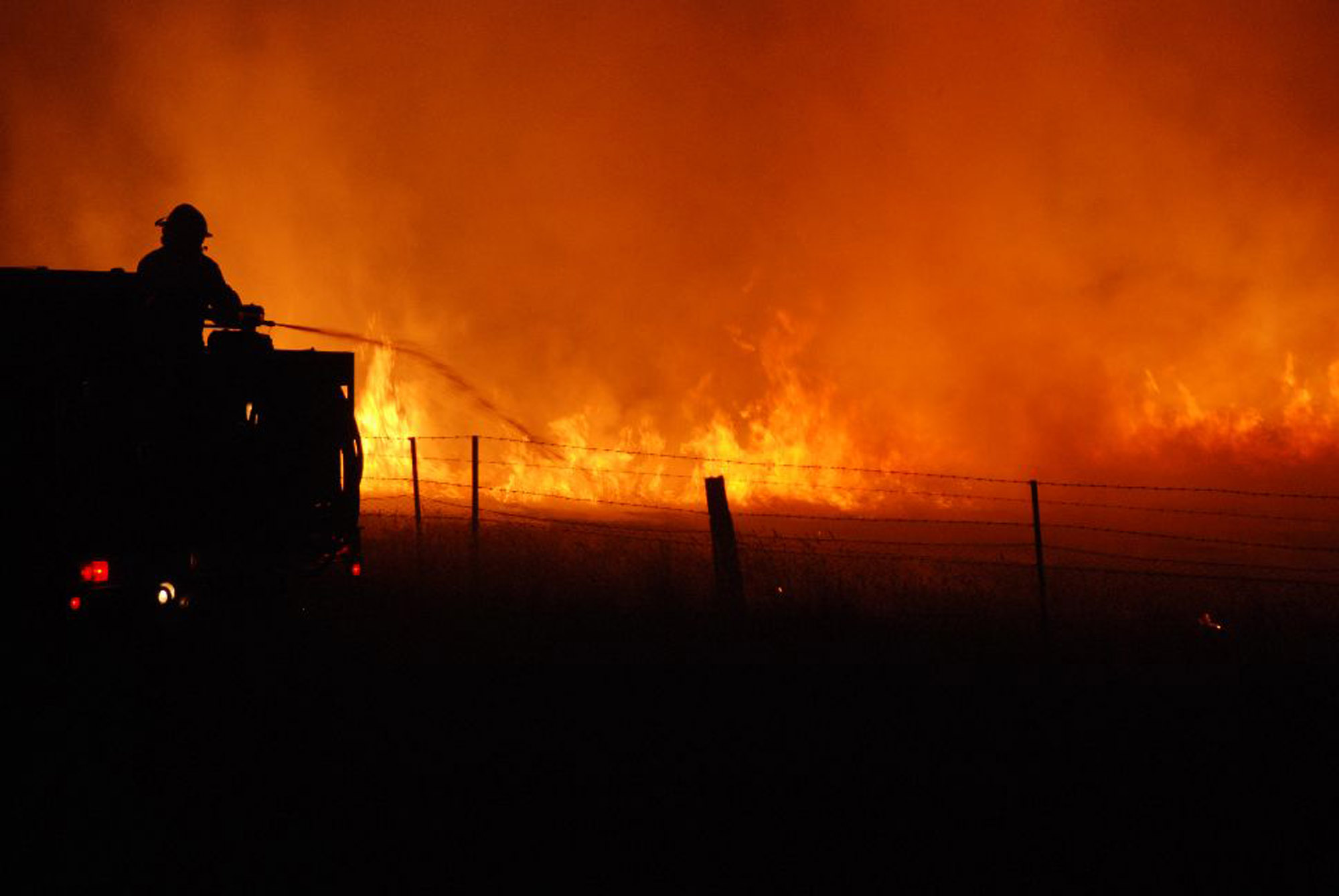 A firefighter battles a blaze in the Victorian township of Taggety on February 7, 2009.