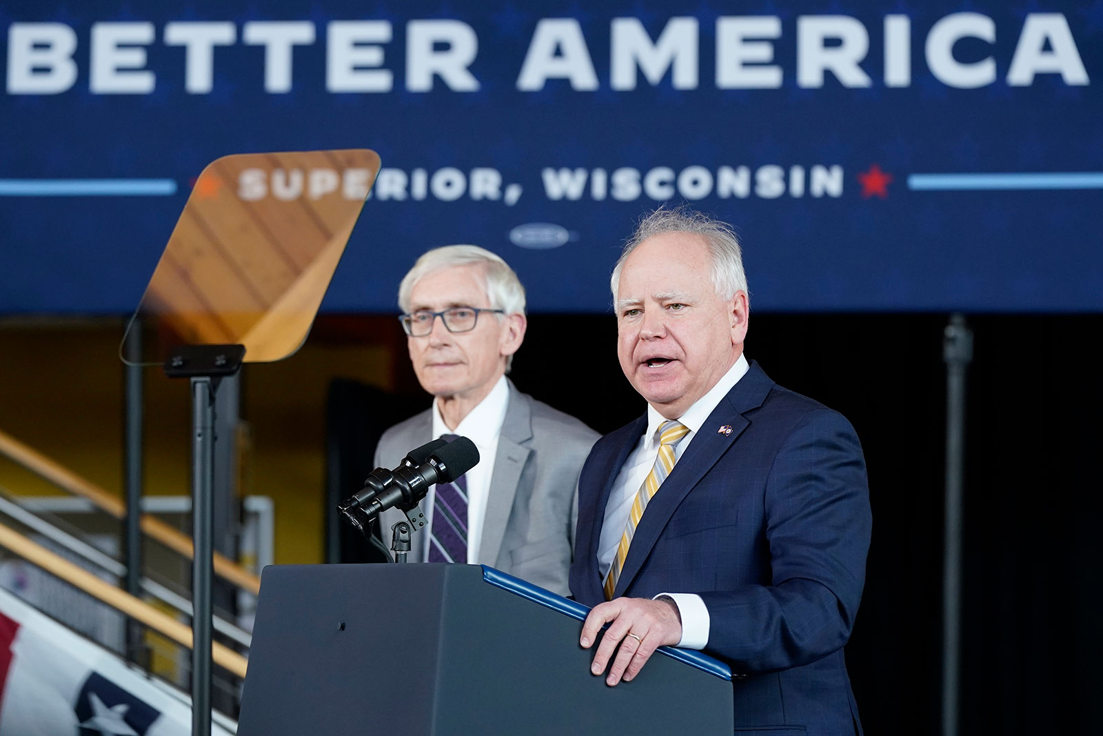 Minnesota Gov. Tim Walz speaks as Wisconsin Gov. Tony Evers listens during an event to promote President Joe Biden's infrastructure agenda at the University of Wisconsin-Superior on March 2. 