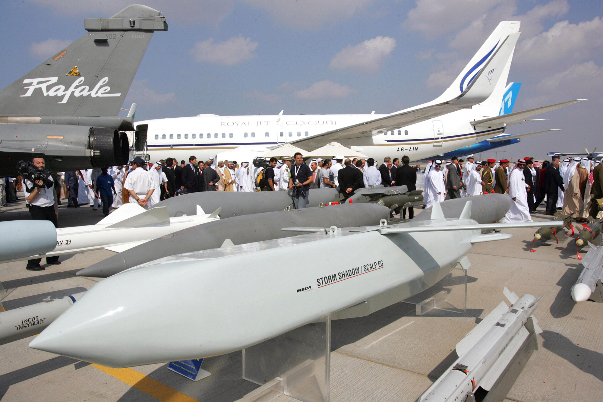Visitors pass behind the French made Storm Shadow/Scalp EG cruise missiles at the opening of the five-day Dubai Air Show in Dubai on November 20, 2005. 