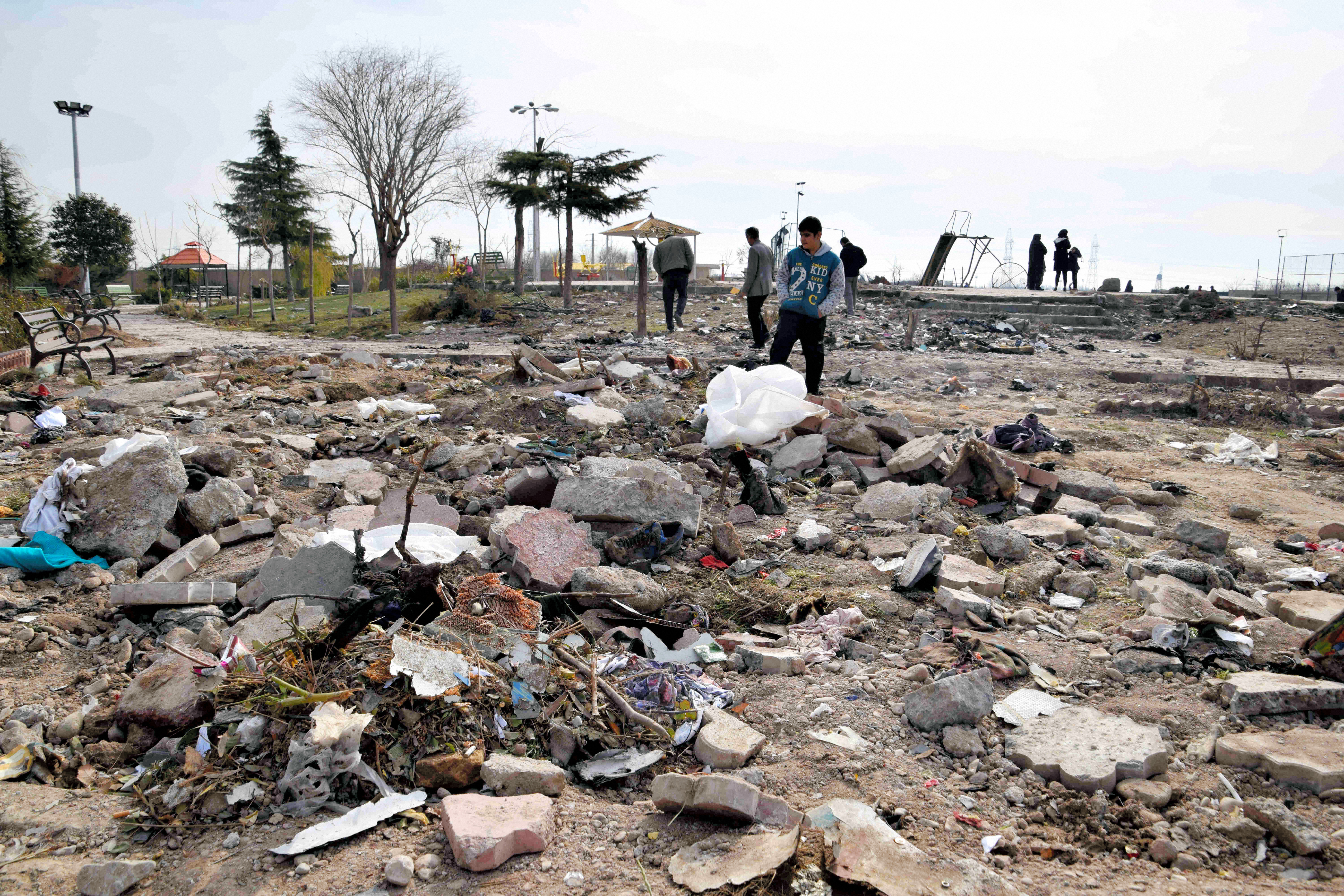 Wreckage from the crash is seen scattered on Friday in Shahedshahr, Iran.