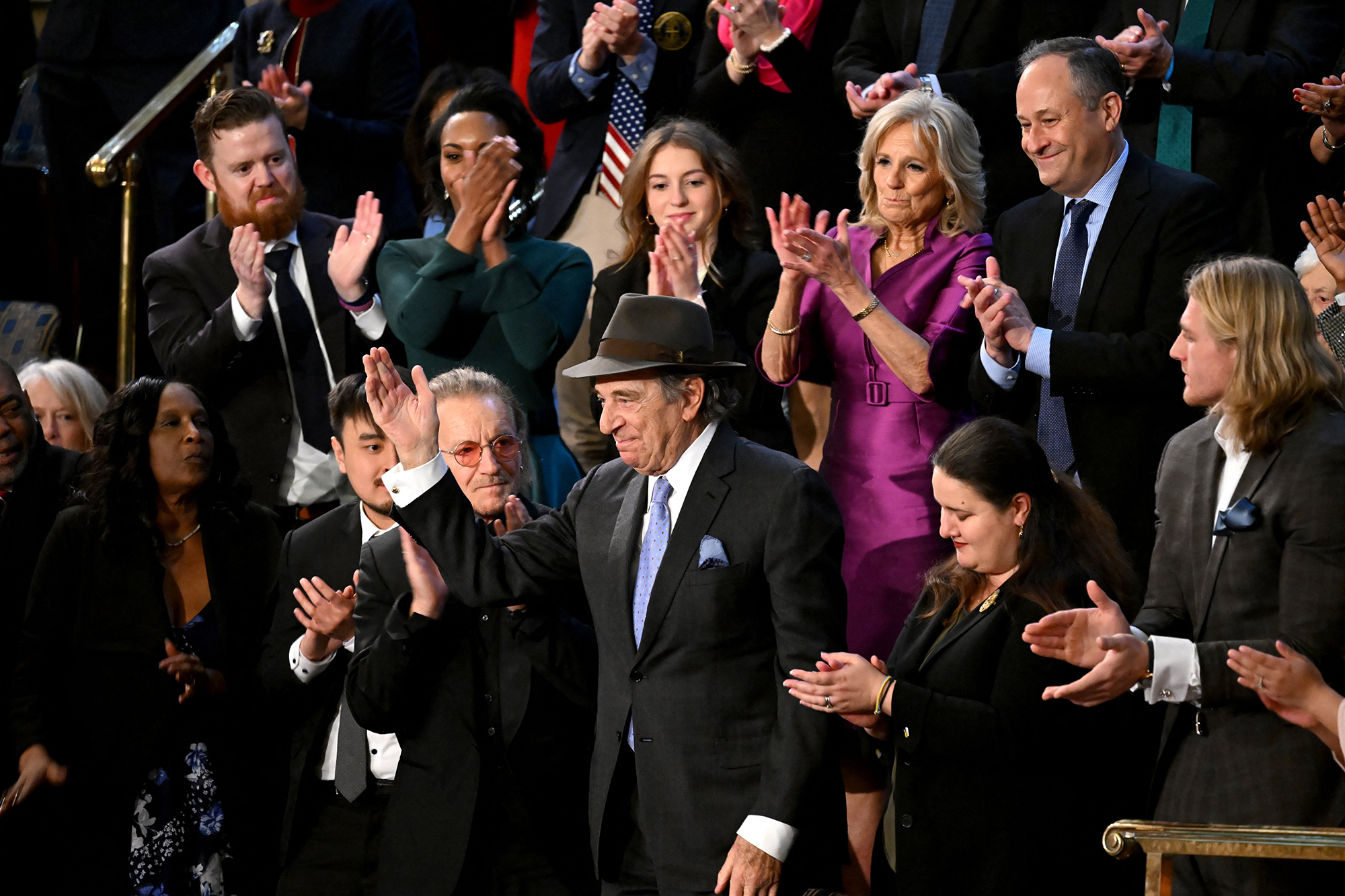 Attendees, including US First Lady Jill Biden and US Second Gentleman Doug Emhoff, applaud Paul Pelosi, husband of US Representative Nancy Pelosi as President Joe Biden delivers the State of the Union address.
