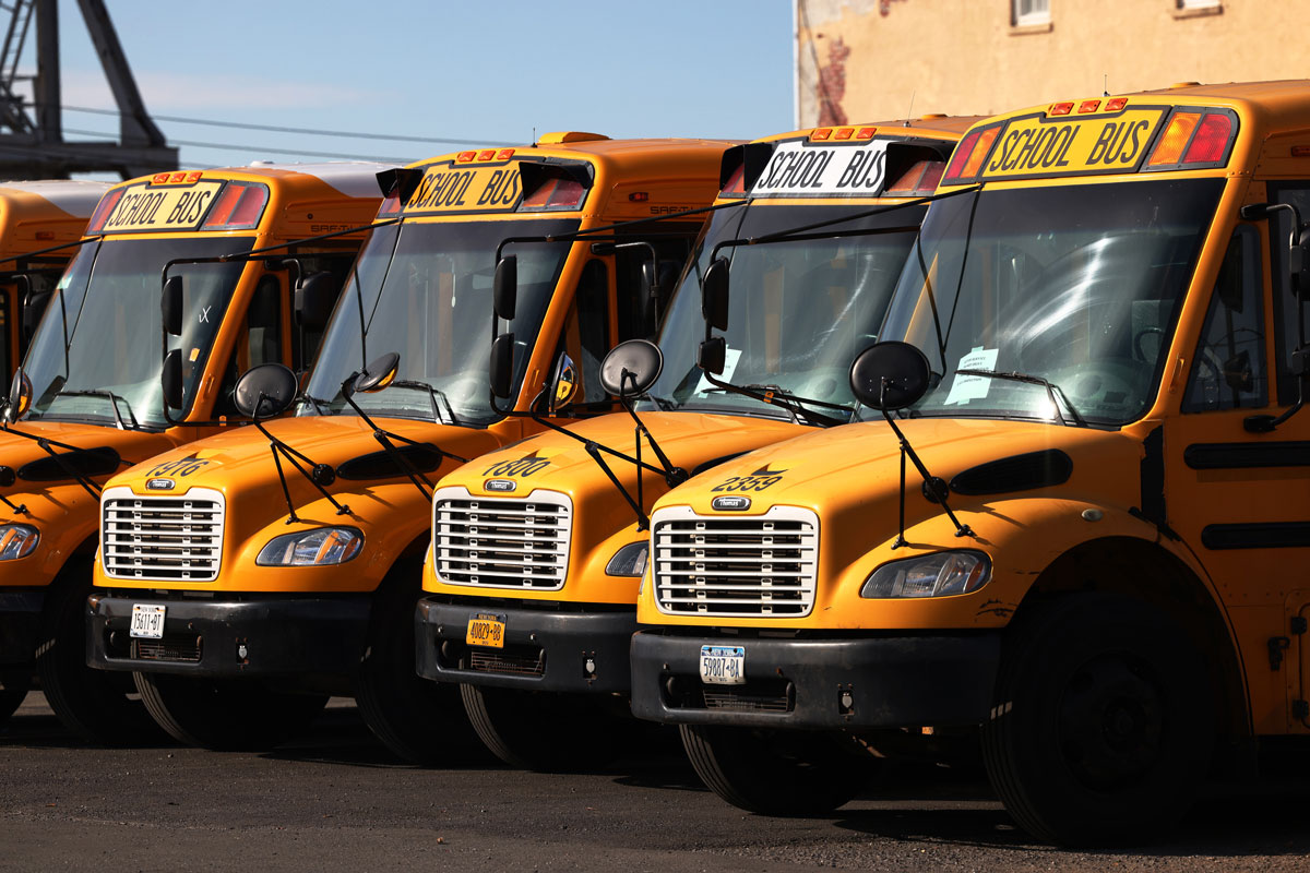 School buses are parked at a bus depot in the Red Hook neighborhood of Brooklyn on November 19, 2020 in New York City.