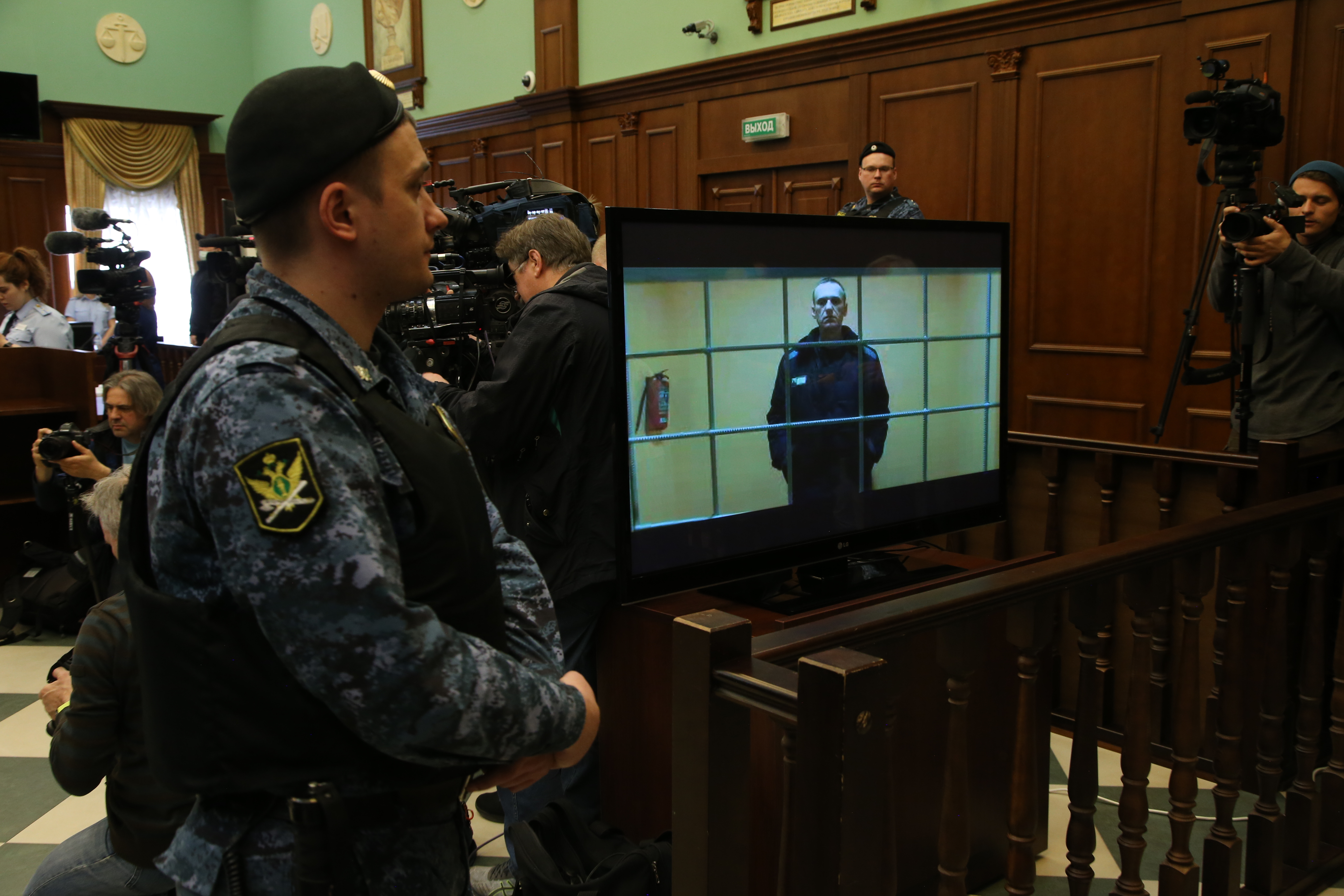 Alexey Navalny is seen on the screen during his legal appeal, in Moscow's City Court, on May 24. 