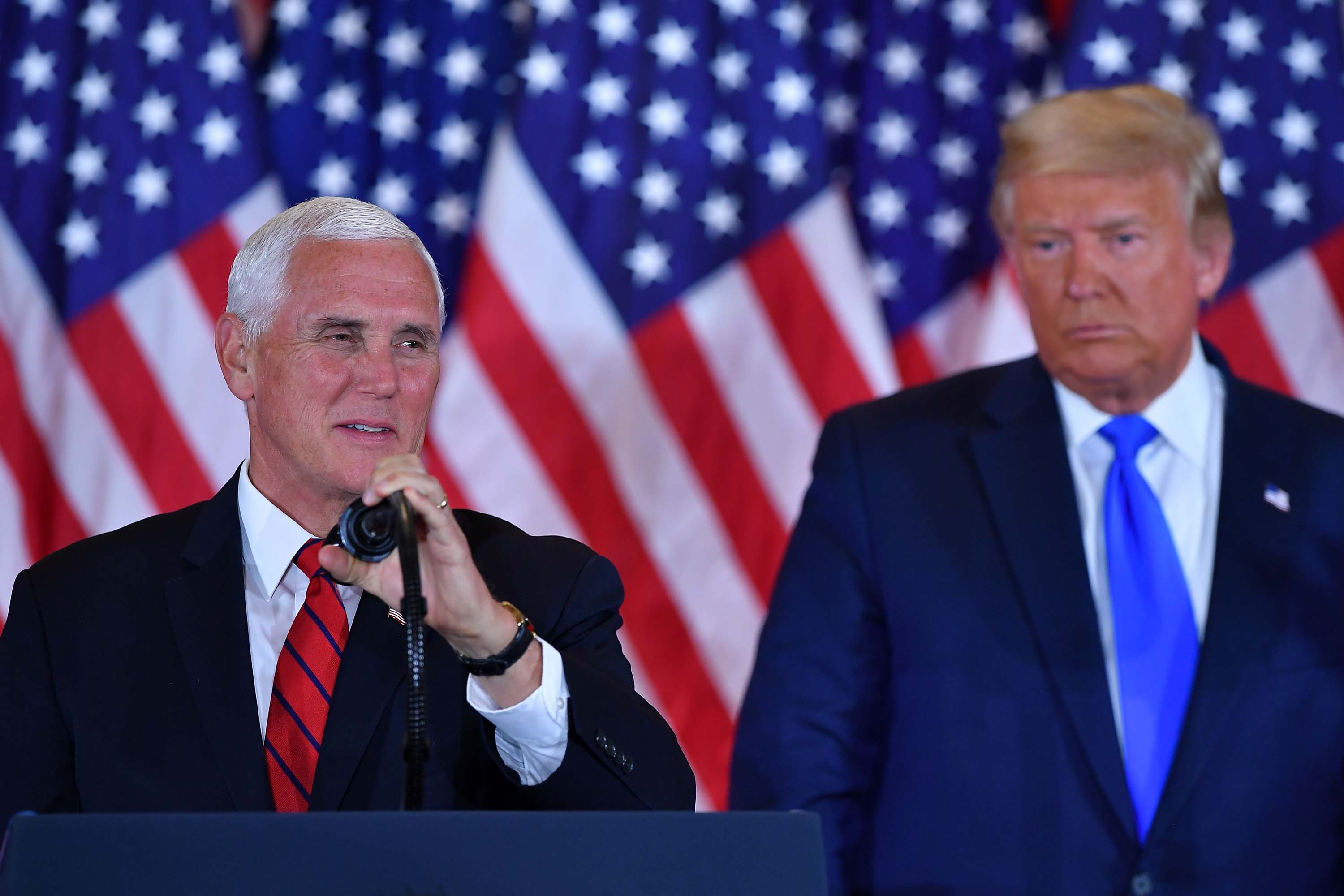 Vice President Mike Pence speaks alongside President Donald Trump in the East Room of the White House in Washington, DC, early on November 4.