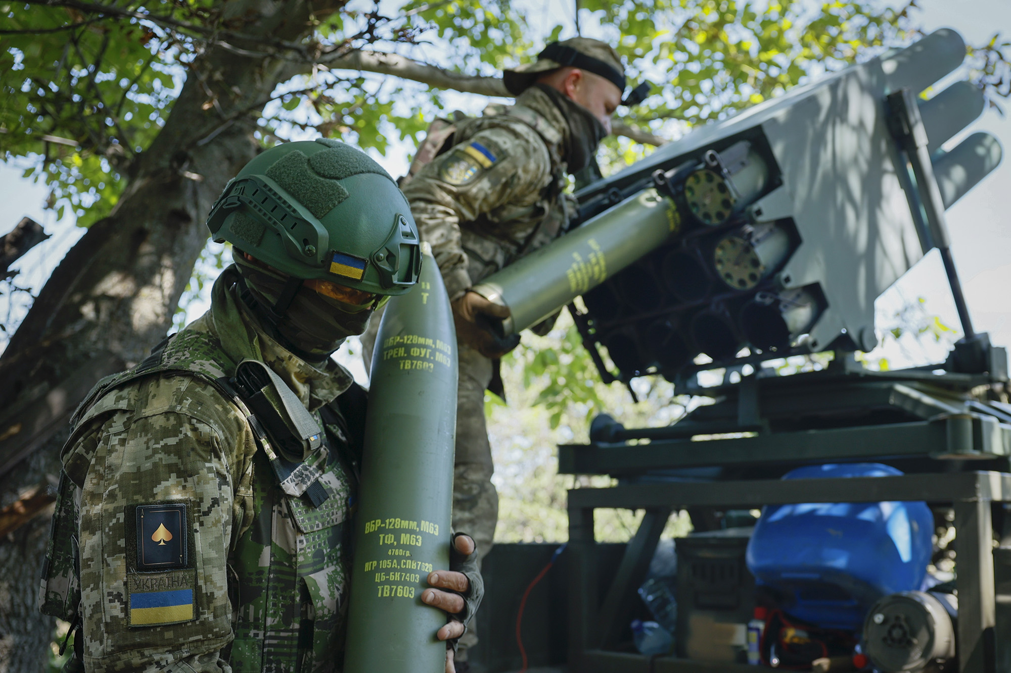 Ukrainian soldiers prepare a Croatian RAK-SA-12 128mm multiple rocket launcher on the frontline near Bakhmut in the Donetsk region, Ukraine, on July 10.