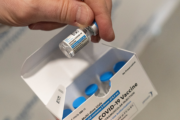 A pharmacist holds a vial of the Johnson & Johnson COVID-19 vaccine at a hospital in Bay Shore, N.Y., on March 3, 2021.