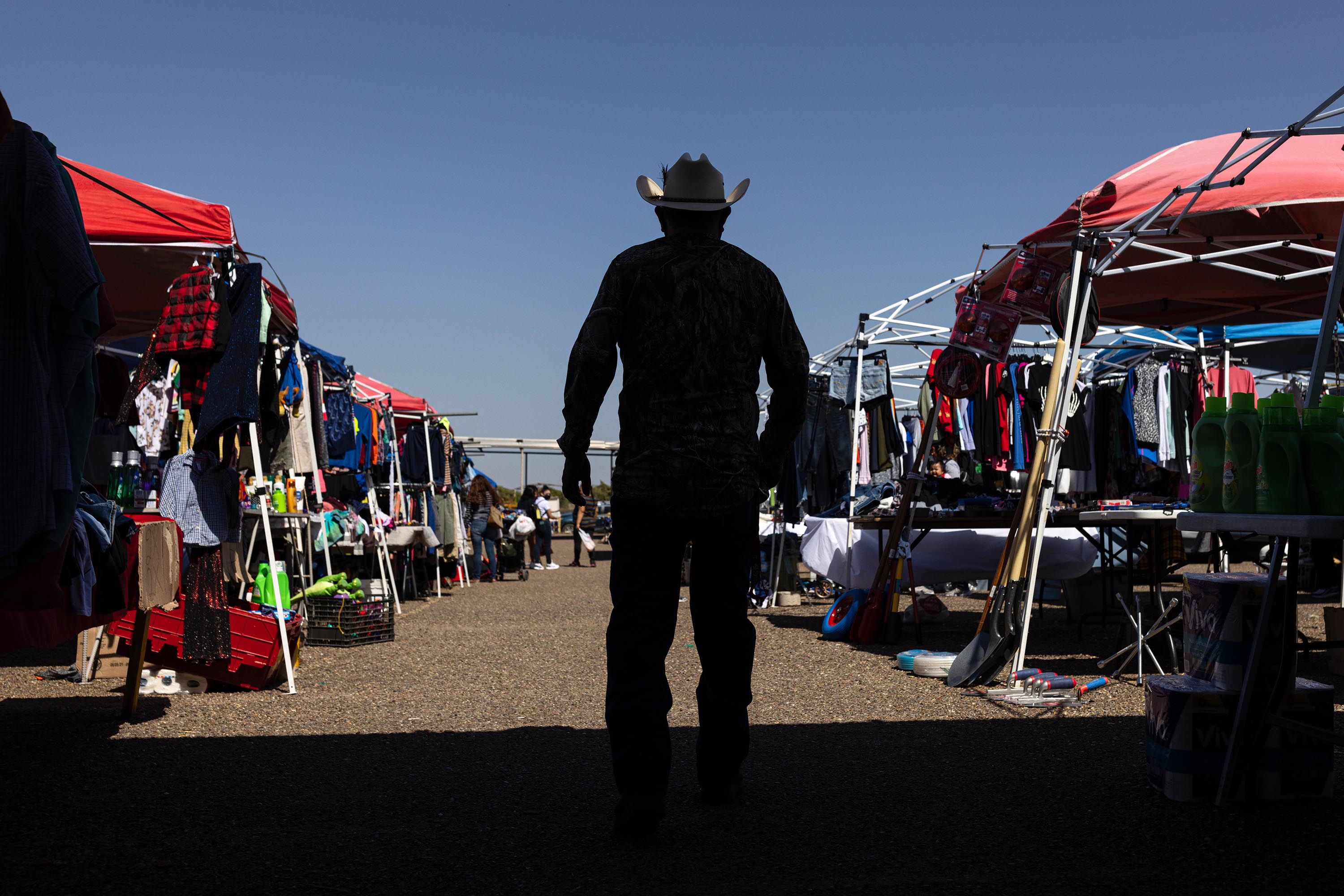 A man walks through the Pulga Los Portales flea market in Alton, Texas, on February 17, 2022. 