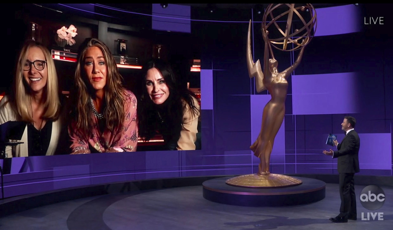 In this video grab captured on Sept. 20, 2020, courtesy of the Academy of Television Arts & Sciences and ABC Entertainment, Jimmy Kimmel, right, speaks with actors, from left, Lisa Kudrow, Jennifer Aniston and Courteney Cox during the 72nd Emmy Awards broadcast.