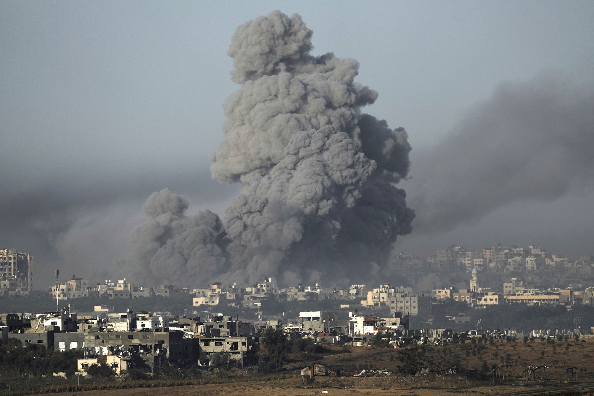 Smoke rises following an Israeli airstrike in Gaza as seen from southern Israel, on November 22.
