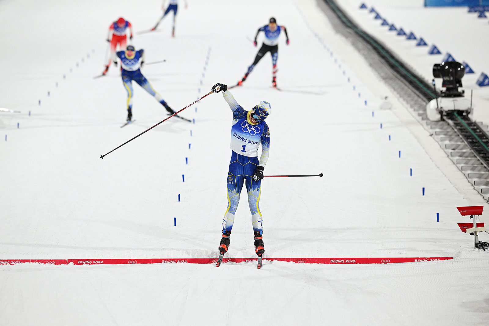 Sweden's Jonna Sundling celebrates while crossing the finish line of the women’s cross country freestyle sprint on February 8. 