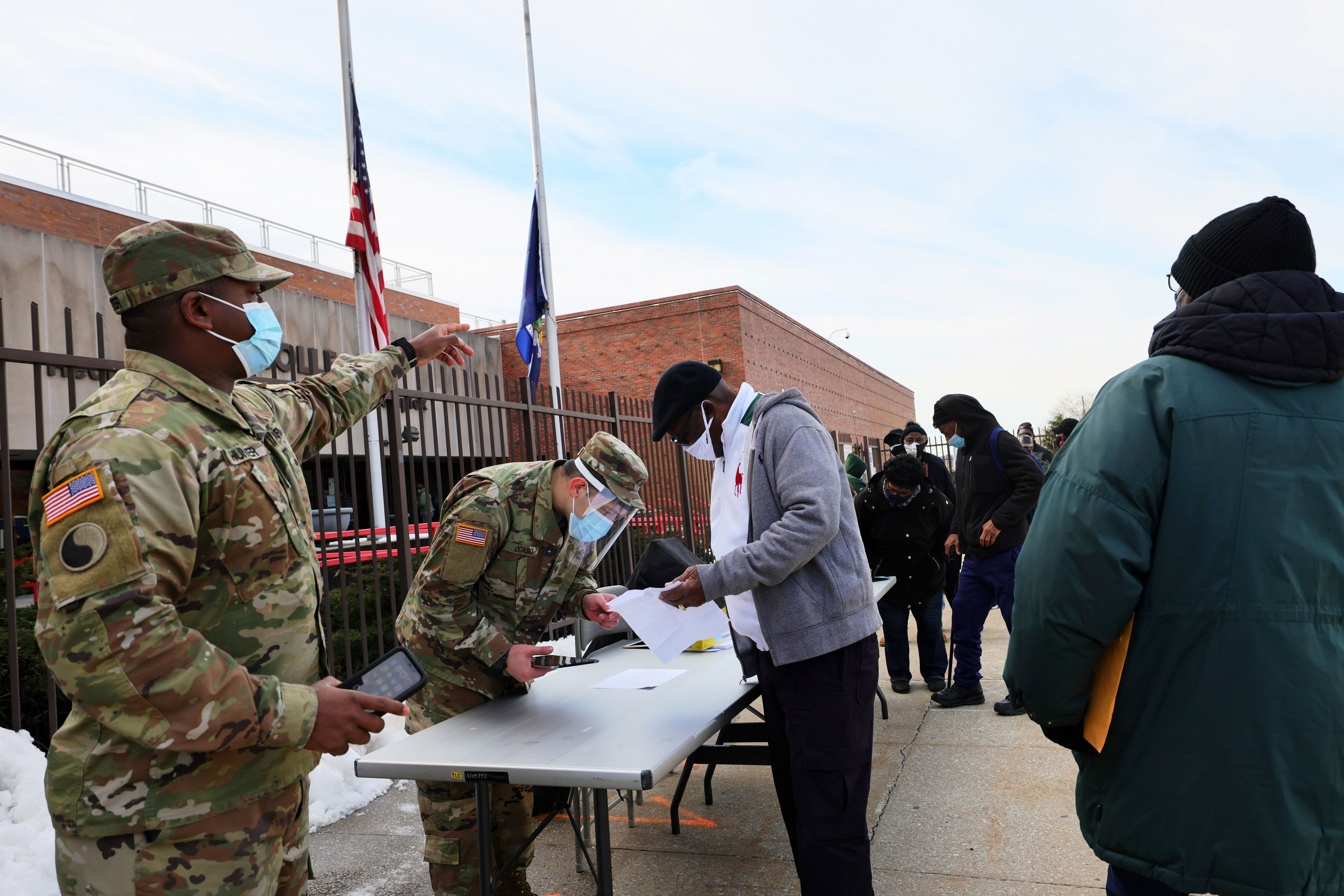 Members of the National Guard help people sign up for their Covid-19 vaccination appointments at York College in Queens, New York, on February 24.