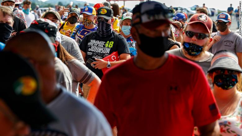 Fans wearing face masks and face coverings enter the race track prior to the NASCAR Cup Series All-Star Race at Bristol Motor Speedway on July 15 in Bristol, Tennessee.