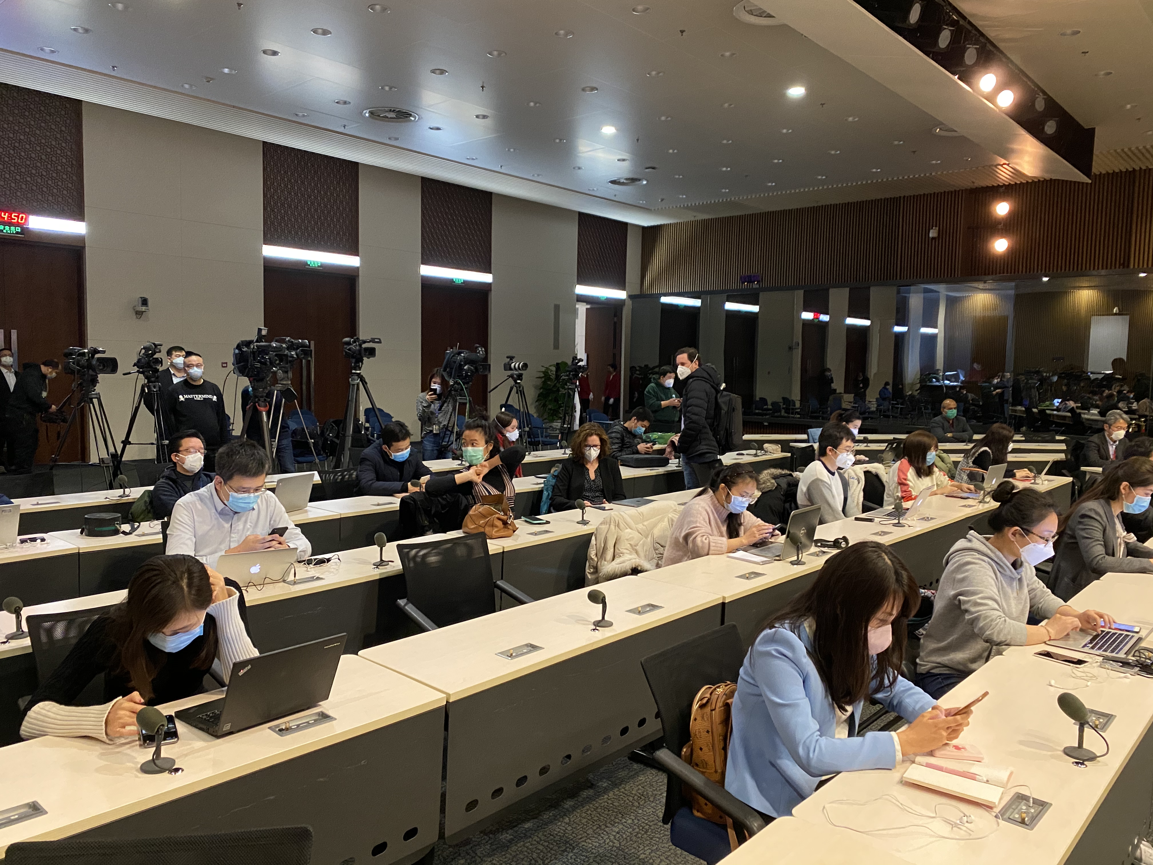 Journalists attend a briefing in Beijing on Monday. 