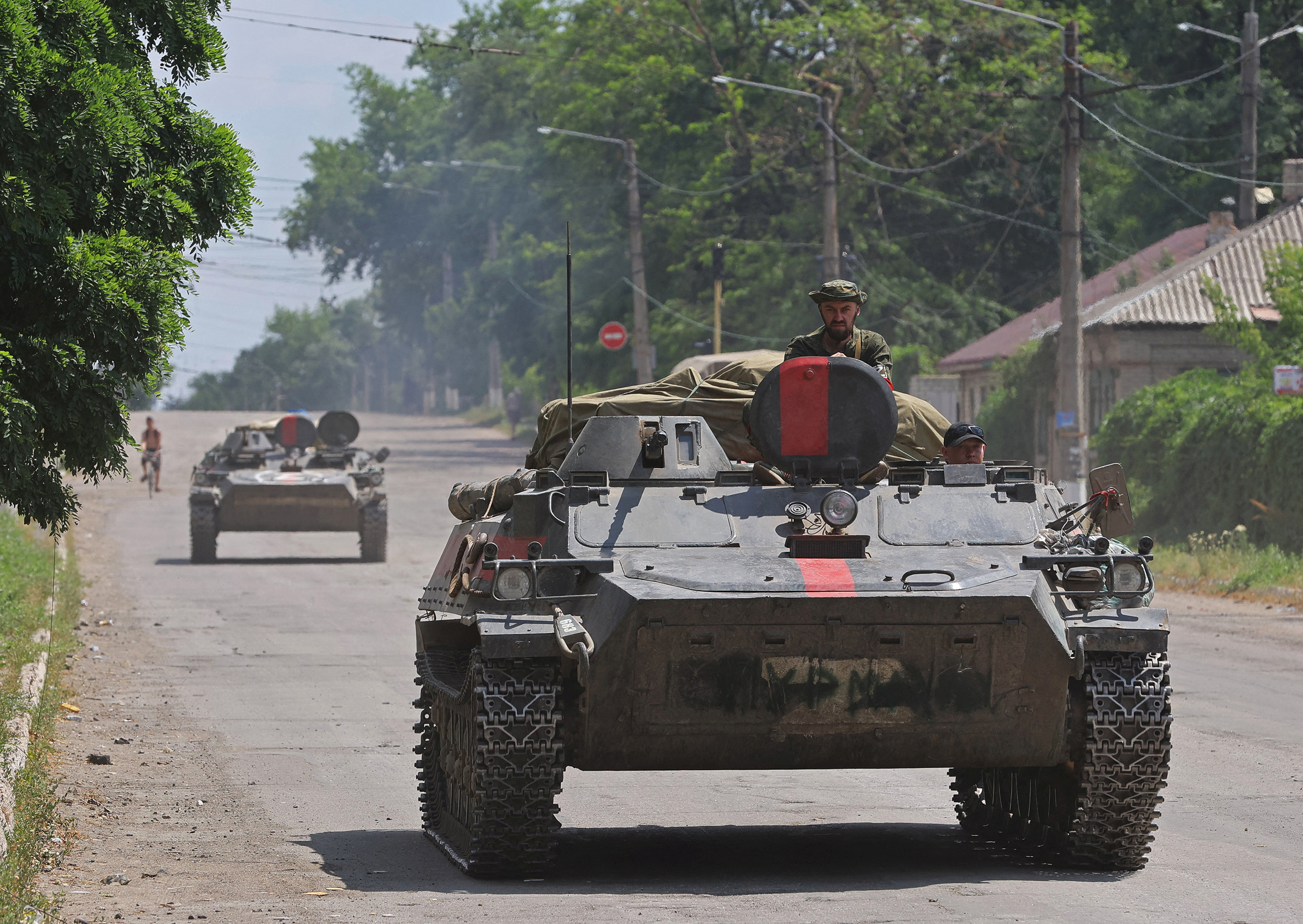 Pro-Russian troops ride an infantry fighting vehicle in the city of Lysychansk in the Luhansk Region, Ukraine, on July 4.