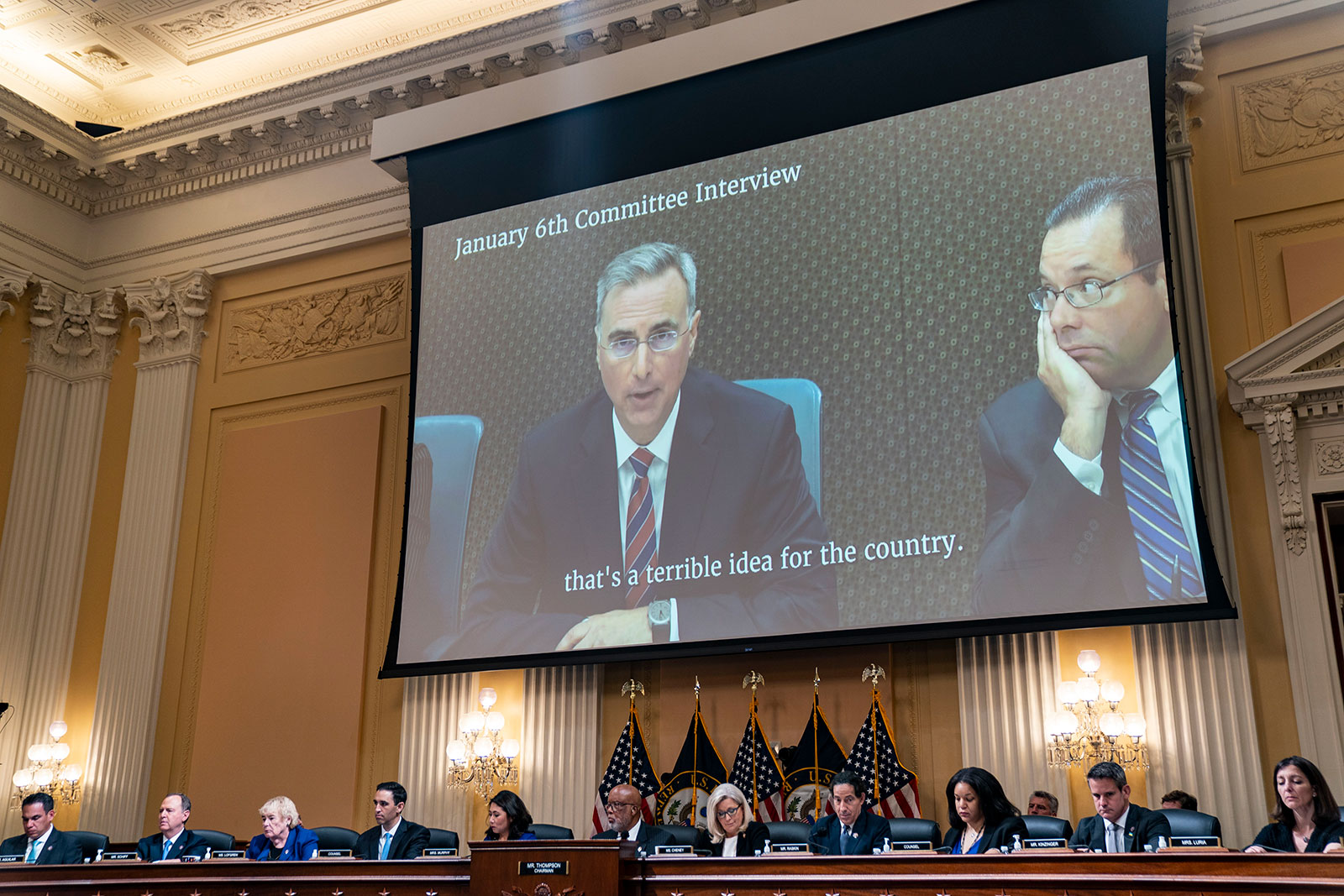 A video deposition of former Trump White House counsel Pat Cipollone is played on screen during the House select committee's hearing on July 12. 
