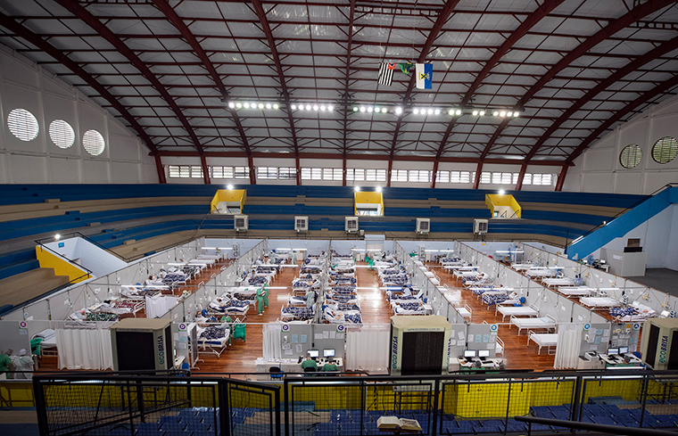 COVID-19 patients lie on beds in a field hospital built inside a gym in Santo Andre, on the outskirts of Sao Paulo, Brazil, on June 9.