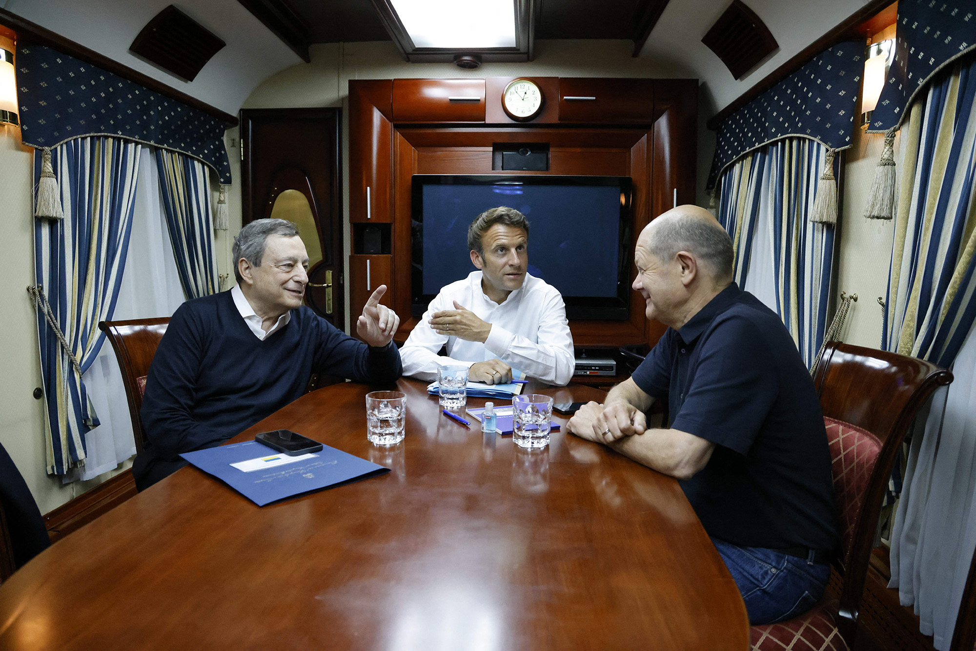 French President Emmanuel Macron, center, German Chancellor Olaf Scholz, right, and Italian Prime Minister Mario Draghi, left, travel on board a train bound to Kyiv, Ukraine, after departing from Poland on June 16.