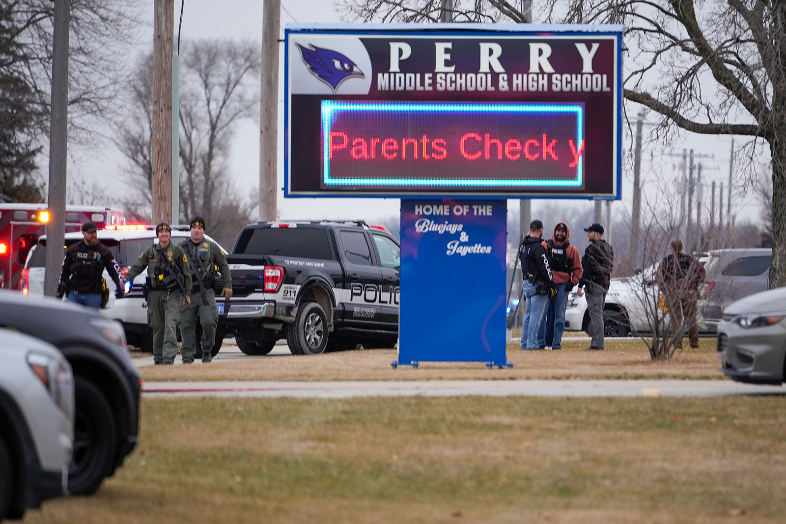 Police respond to Perry High School in Perry, Iowa, on Thursday. 
