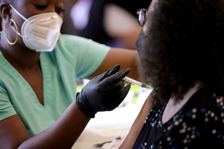 Maryland residents receive their second dose of the Moderna coronavirus vaccine at the Cameron Grove Community Center on March 25, 2021 in Bowie, Maryland. 