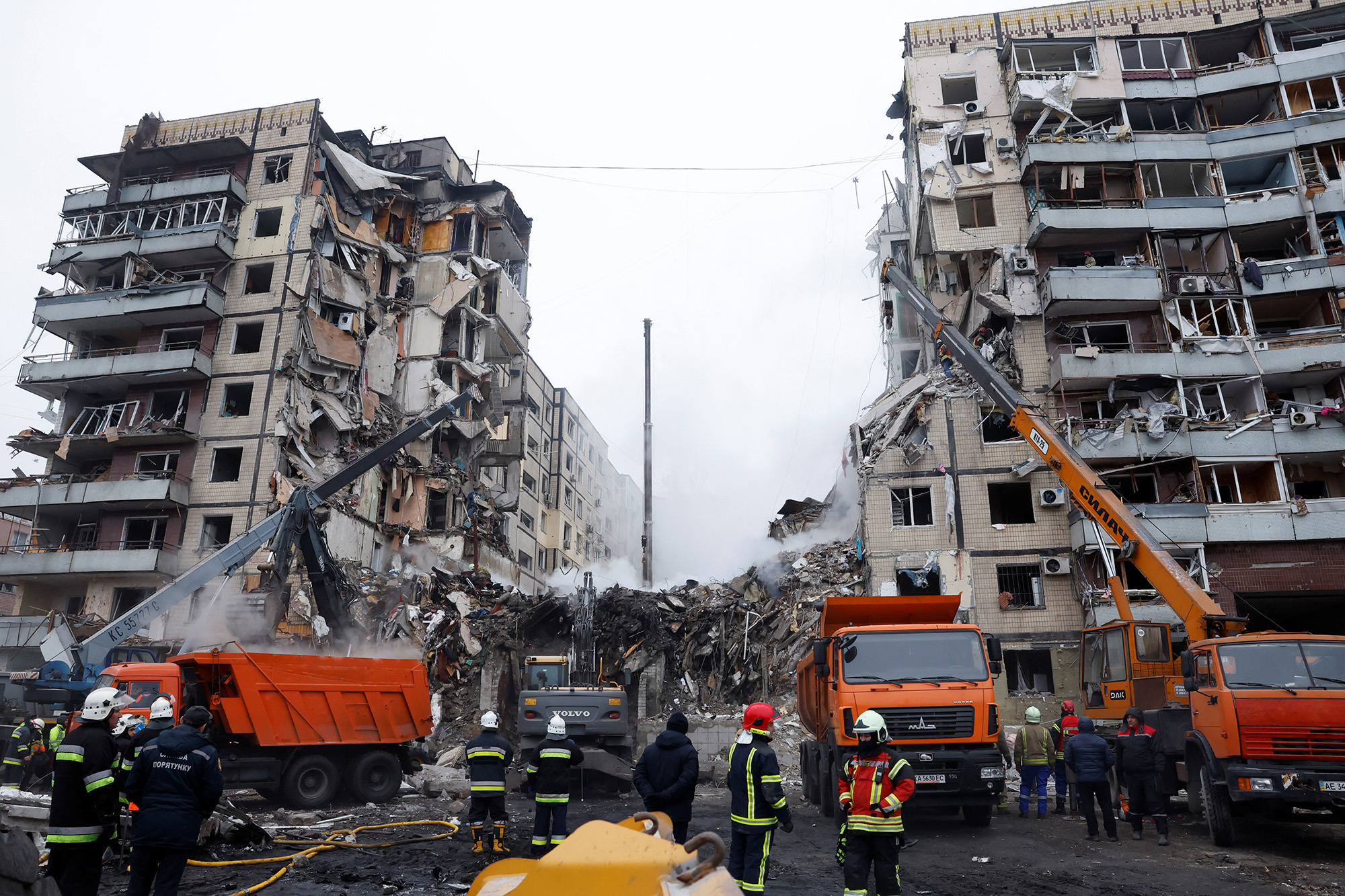 Emergency personnel work at an apartment block hit by a Russian missile strike in Dnipro, Ukraine, on January 15.