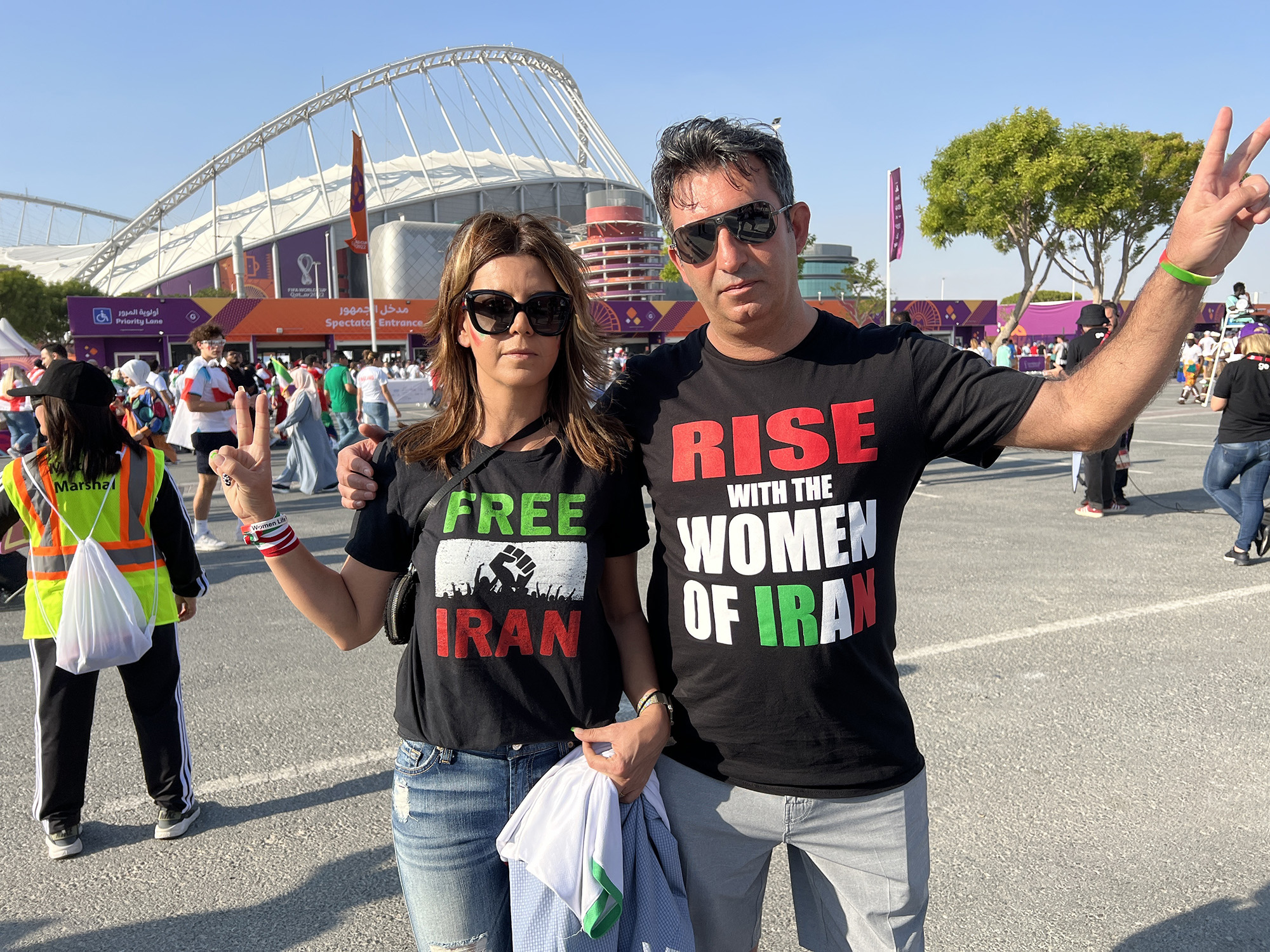 Iranian-born fans Sam Mohsen and Venus Vanaki outside the stadium in Doha, Qatar.