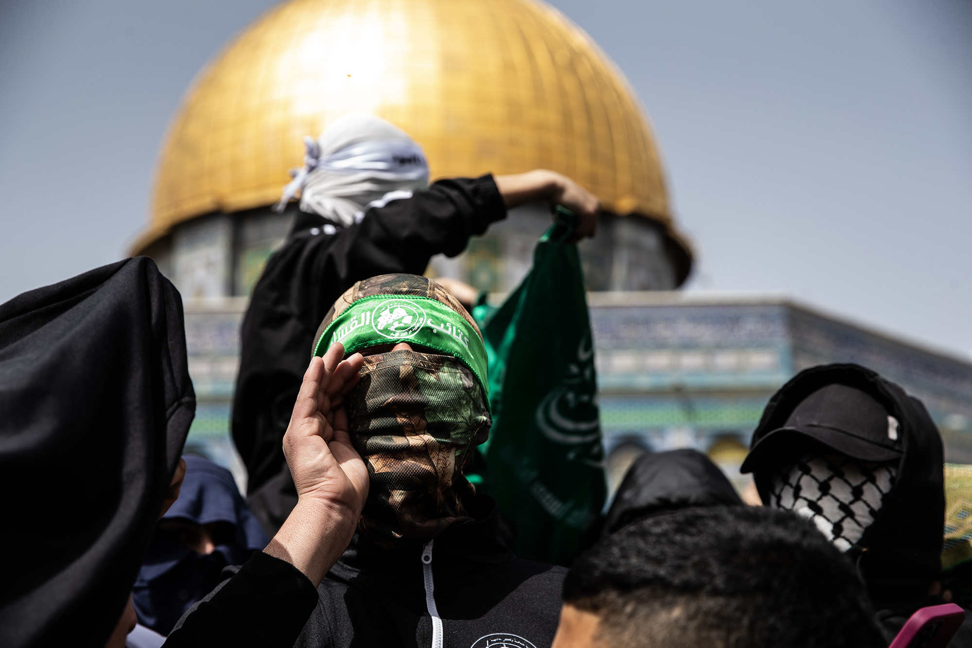 Palestinians protest Israel's politics after performing first Friday prayer of Ramadan at Masjid al-Aqsa in Jerusalem on March 24.