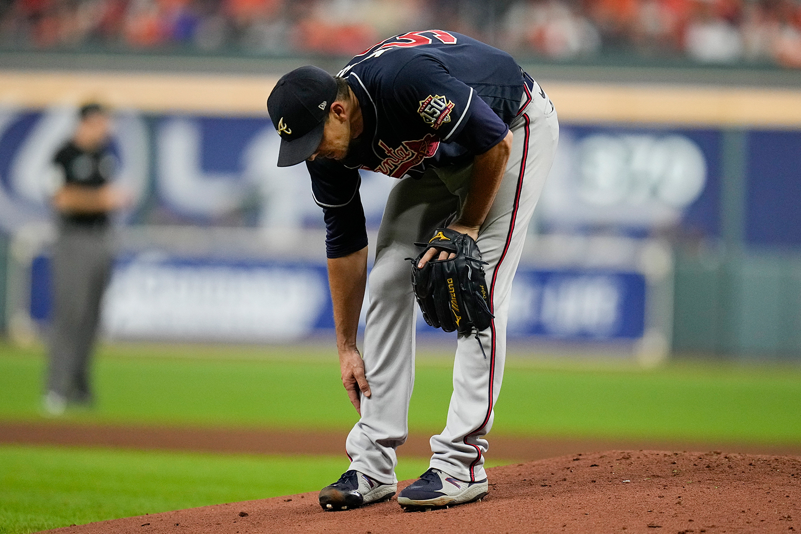 Atlanta Braves starting pitcher Charlie Morton rubs his leg before leaving the game during the third inning.