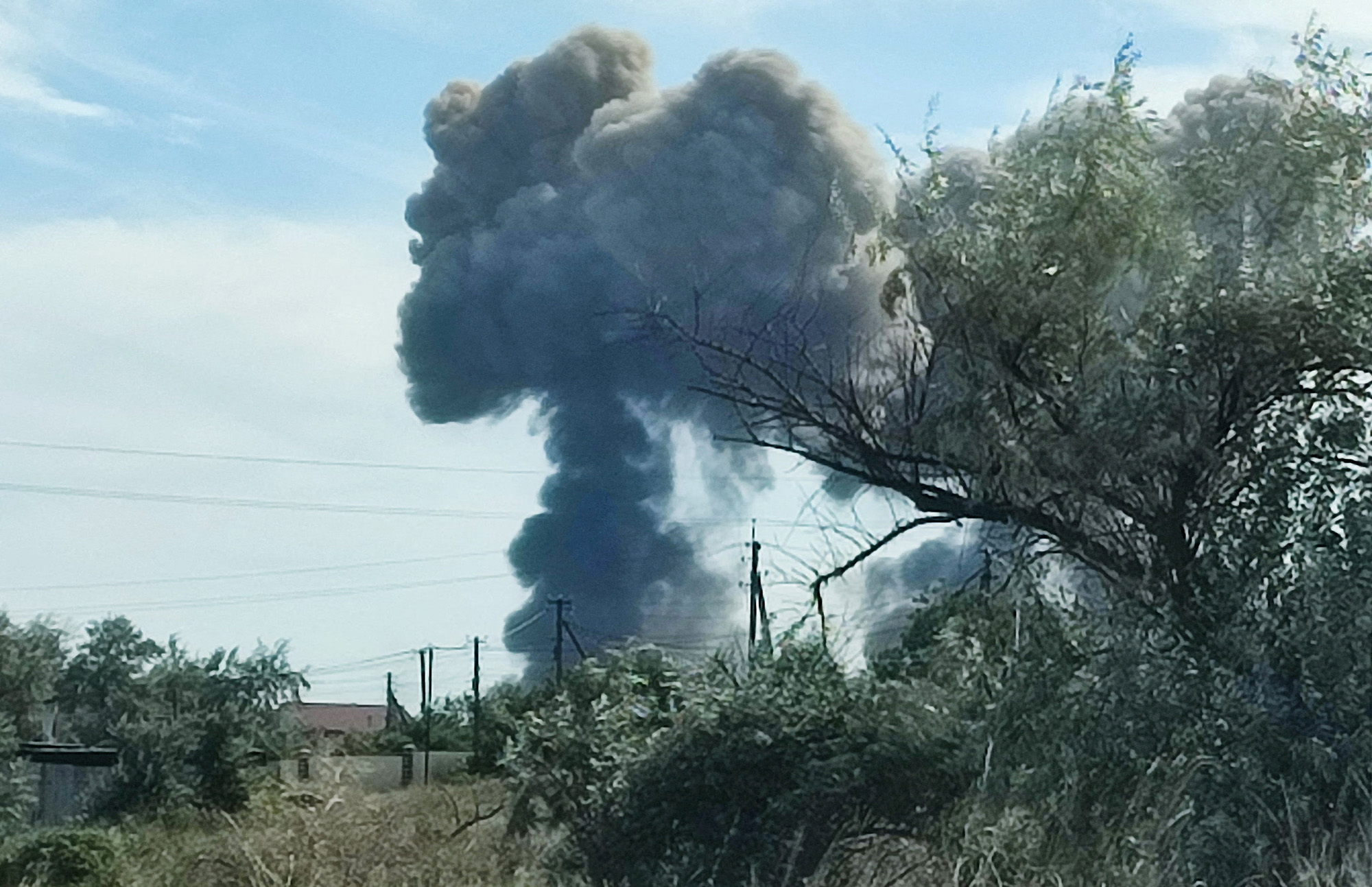 Smoke rises after explosions were heard from the direction of a Russian military airbase near Novofedorivka, Crimea on August 9.