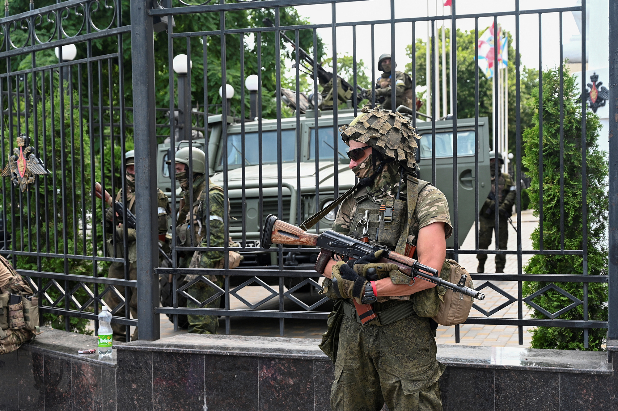 Wagner fighters stand guard outside the headquarters of the Southern Military District in Rostov-on-Don, Russia, on June 24. 