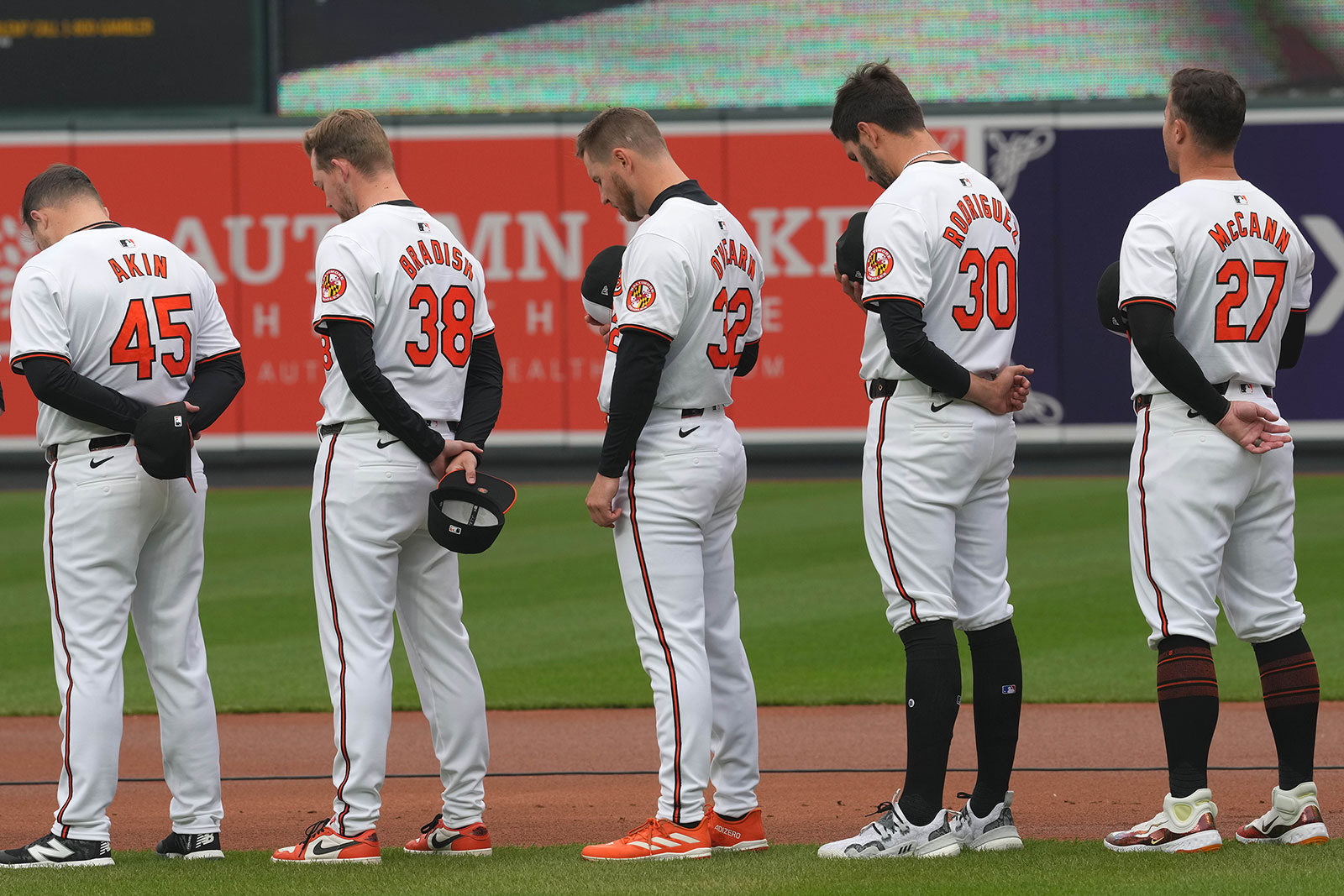 Baltimore Orioles players observe a moment of silence at Oriole Park at Camden Yards on Thursday prior to the game against the Los Angeles Angels in honor of the victims of the Francis Scott Key Bridge collapse in Baltimore. 