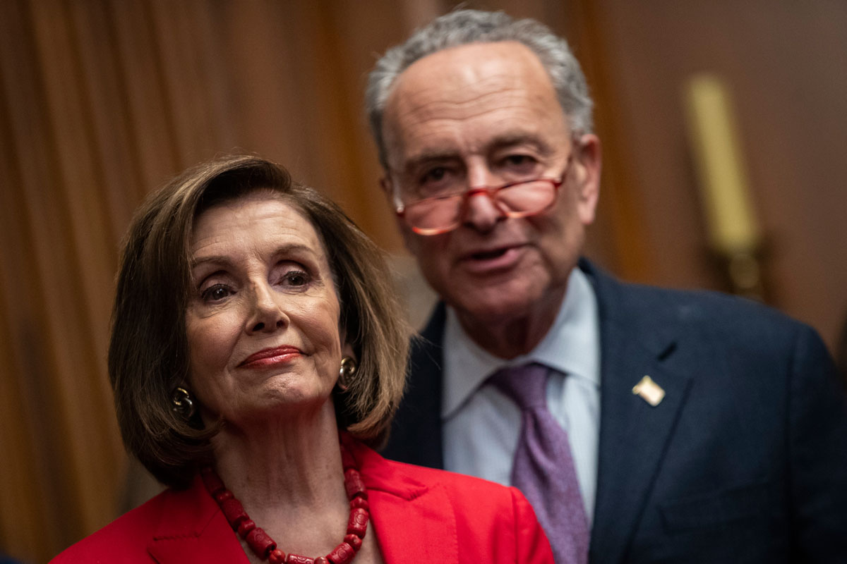 Speaker of the House Nancy Pelosi and Senate Minority Leader Chuck Schumer look on at a press conference with DACA recipients at the U.S. Capitol on November 12, 2019 in Washington, DC.