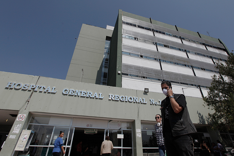 People walk outside the IMSS regional hospital #1 of Queretaro on March 20, in Queretaro, Mexico. A