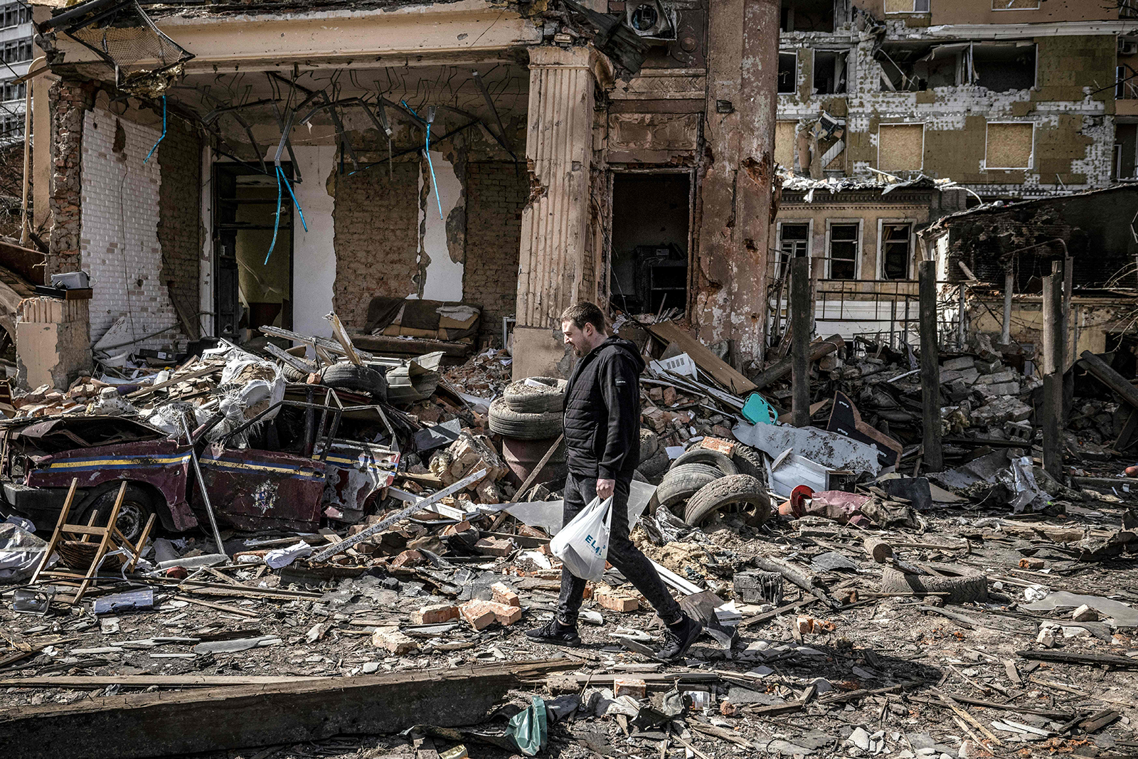 A man walks in the rubble of a destroyed building in the eastern Ukraine city of Kharkiv on April 2.