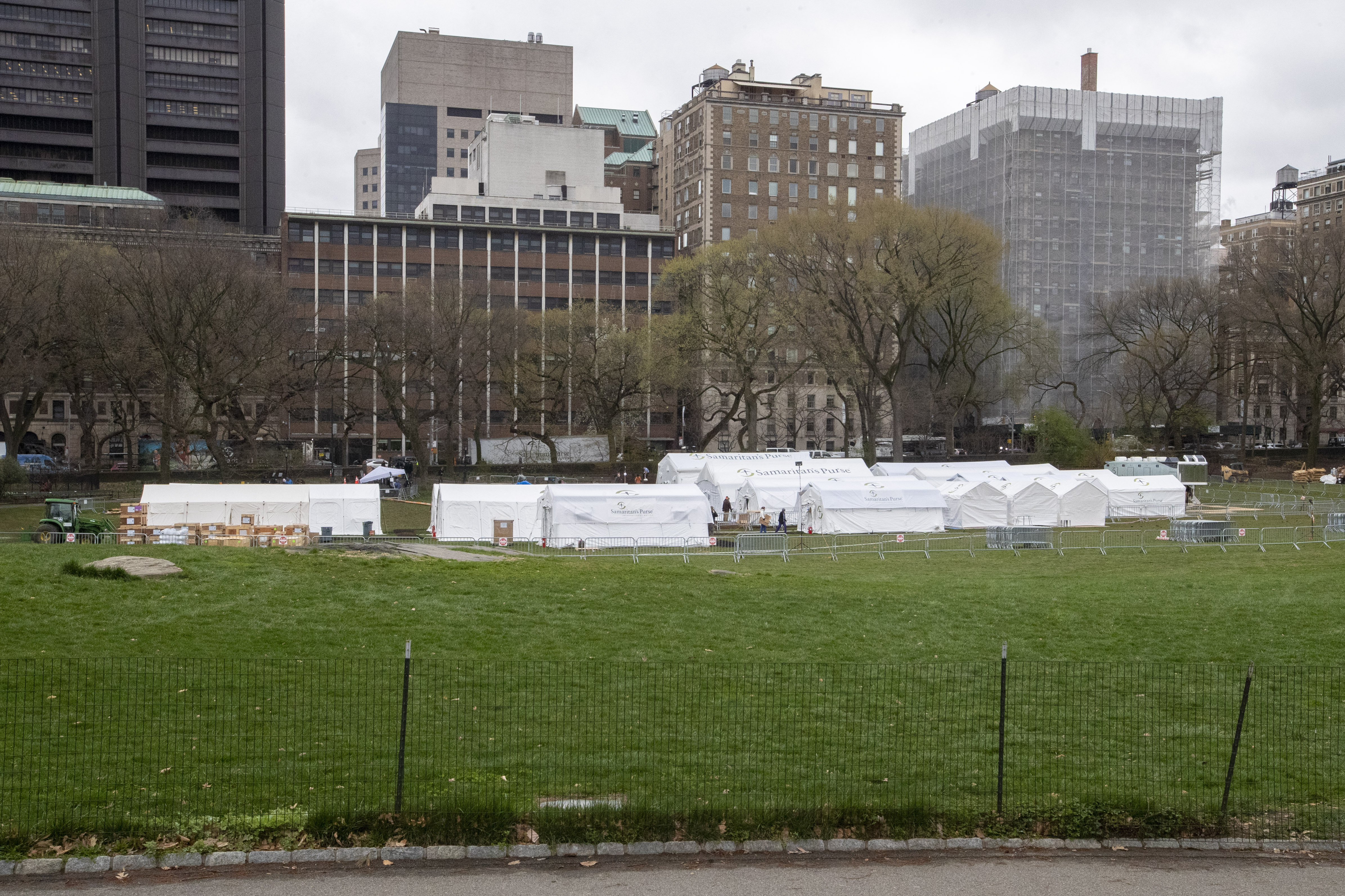 A Samaritan's Purse crew and medical personnel work on preparing an emergency field hospital in New York's Central Park on Tuesday, March 31.