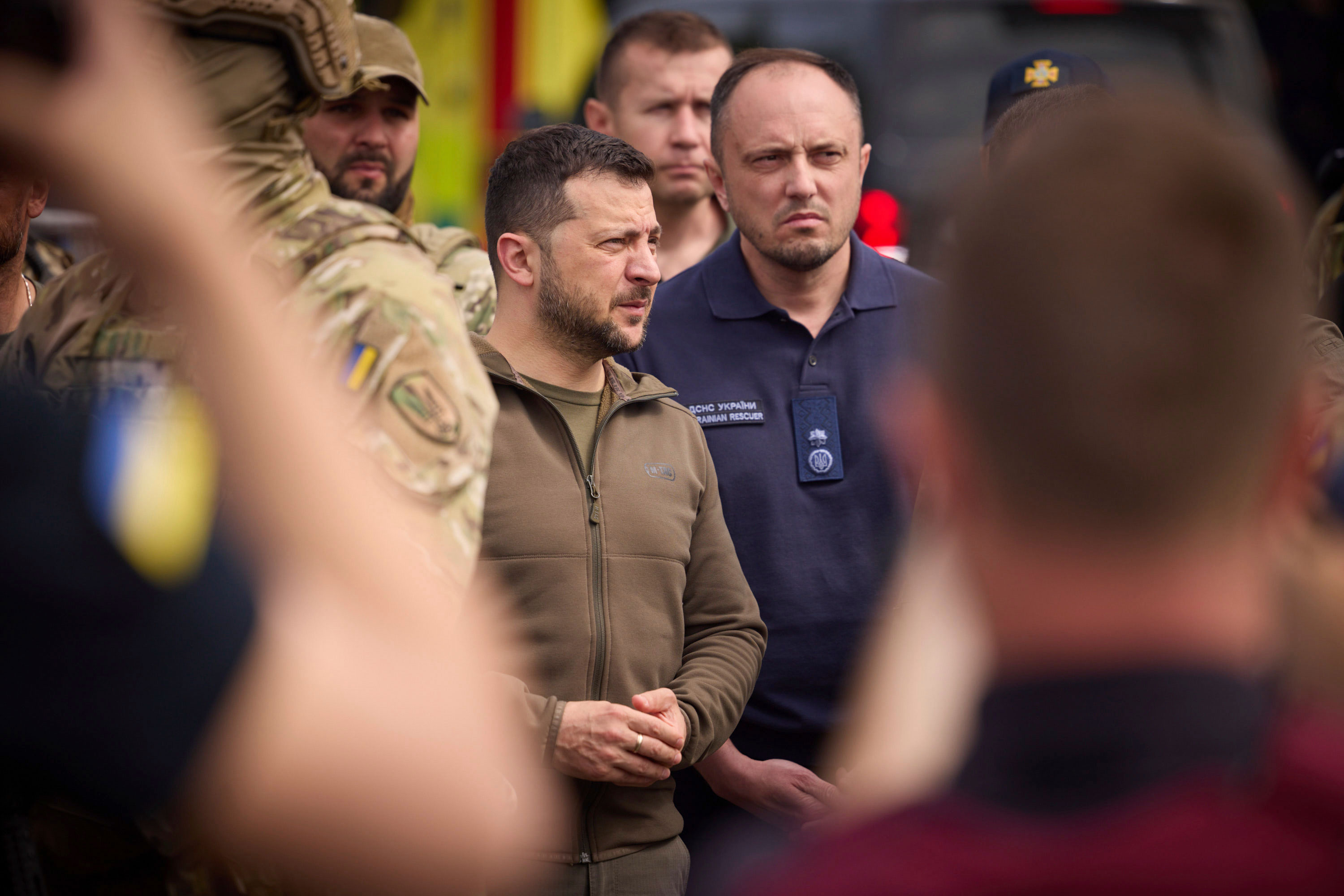 Ukrainian President Volodymyr Zelensky visits areas impacted by flooding in Kherson on June 8. 