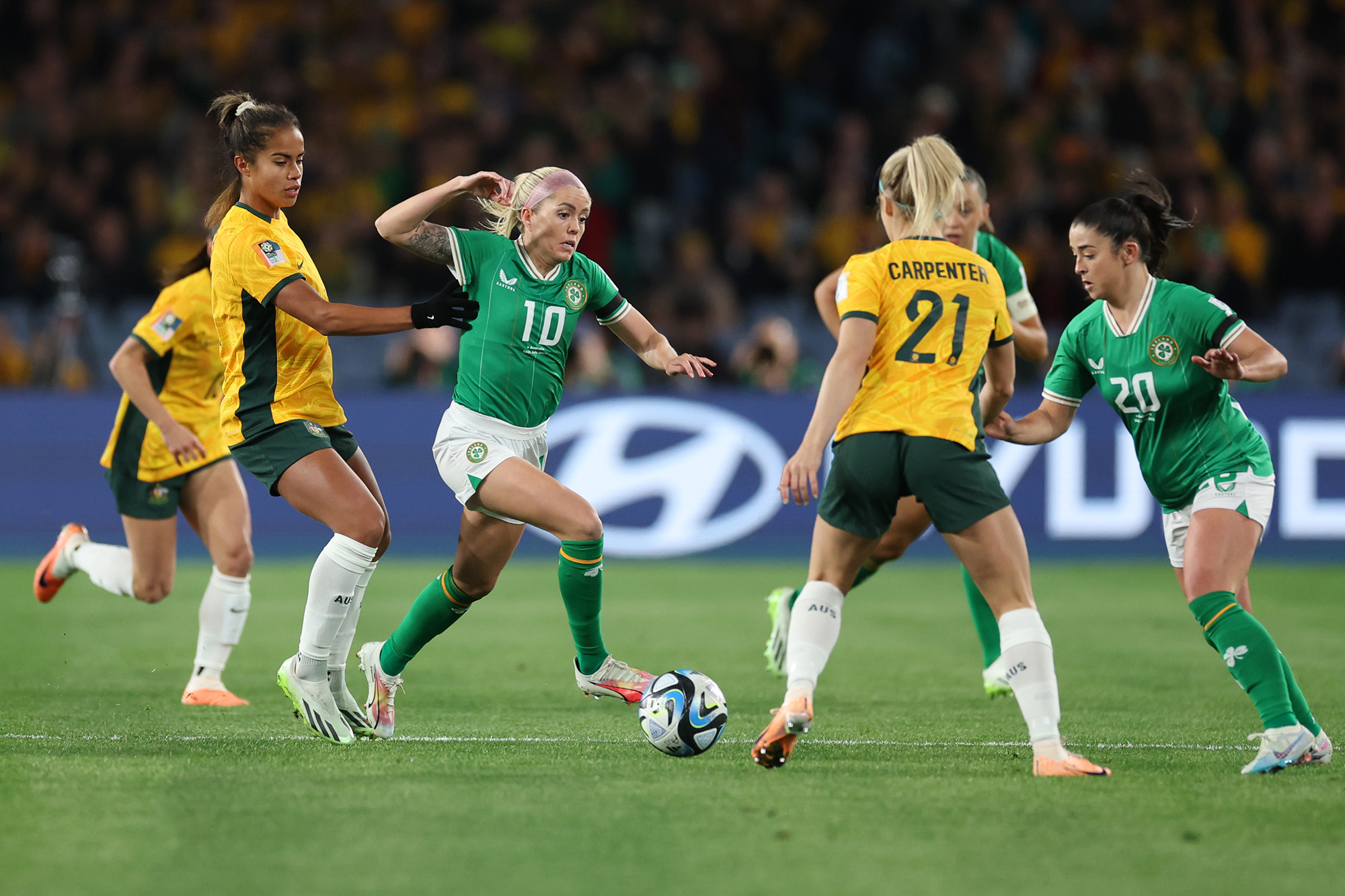 Denise O'Sullivan (10) of Republic of Ireland controls the ball against Mary Fowler and Ellie Carpenter of Australia during the FIFA Women's World Cup Group B match between Australia and Ireland at Stadium Australia on July 20, in Sydney, Australia. 