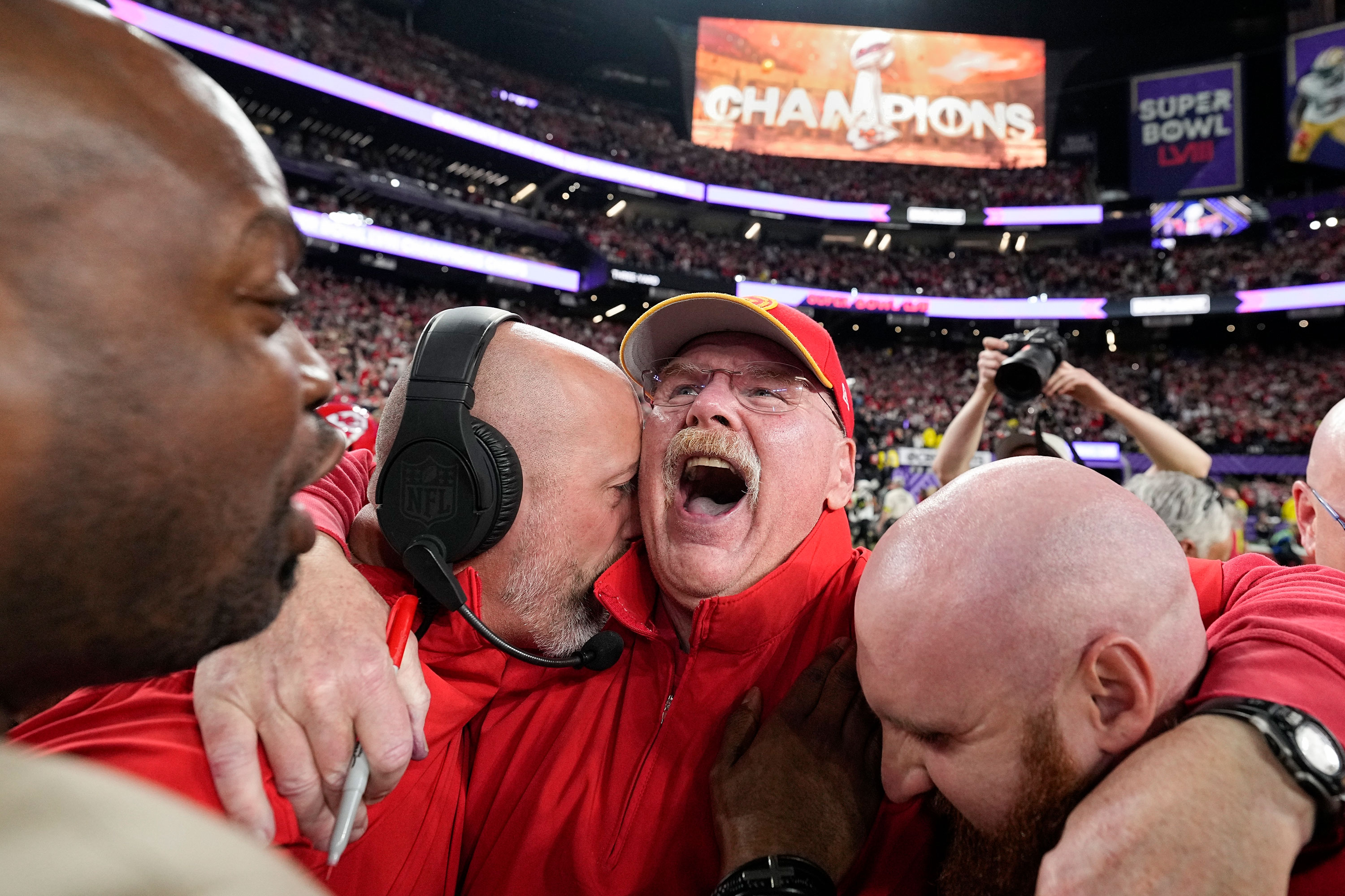 Kansas City Chiefs head coach Andy Reid, center, celebrates.