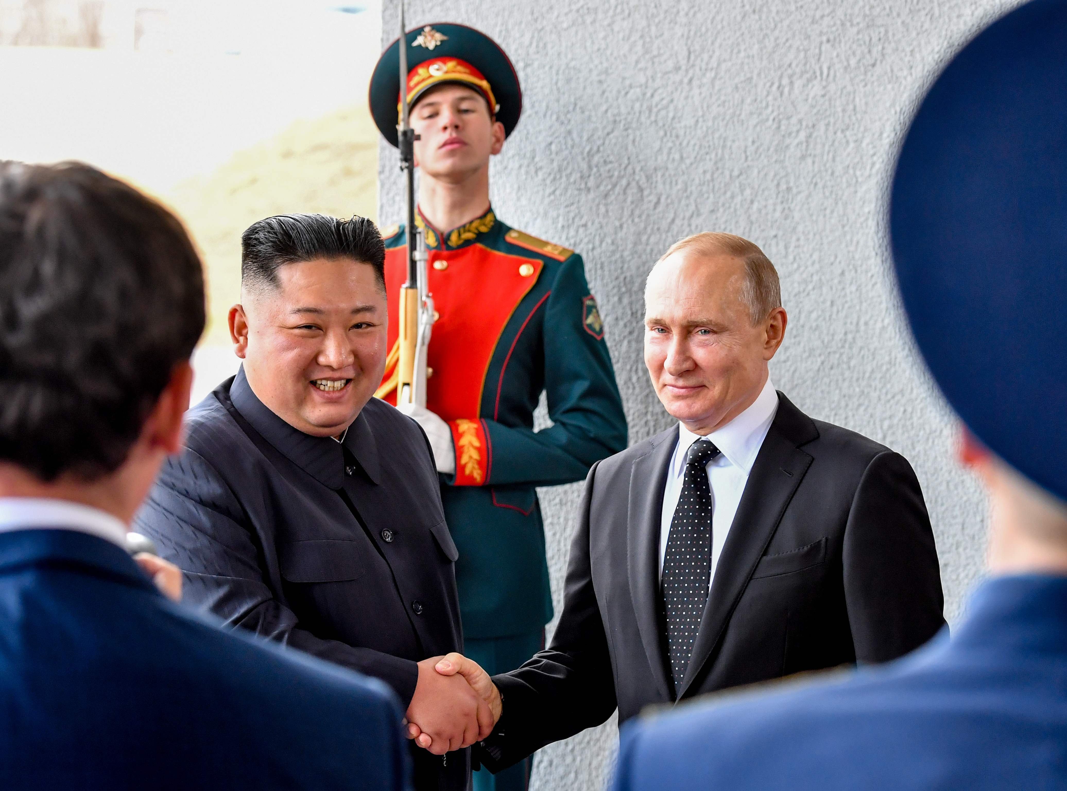 Russian President Vladimir Putin welcomes North Korean leader Kim Jong Un before their talks on Thursday.